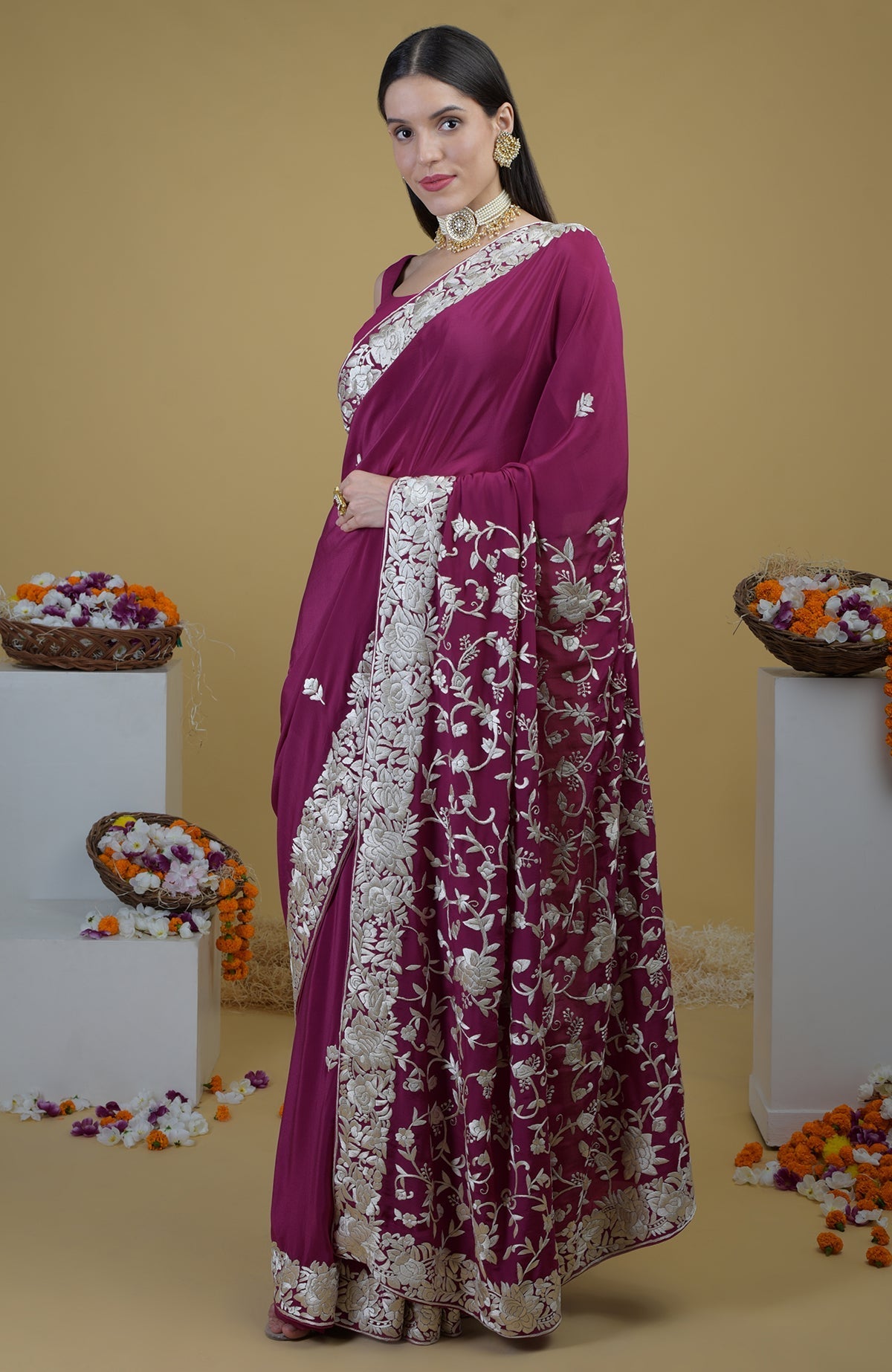 Peacock pink Parsi Gara hand embroidered saree with intricate floral designs.