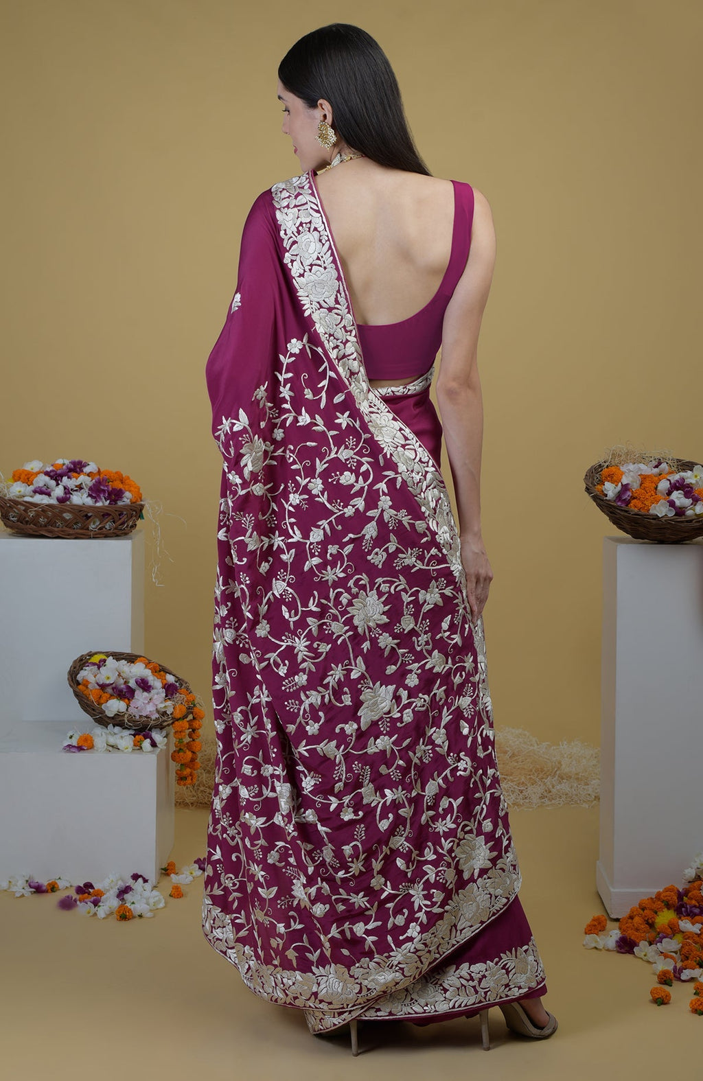 Peacock pink Parsi Gara hand embroidered saree with intricate ivory floral patterns.