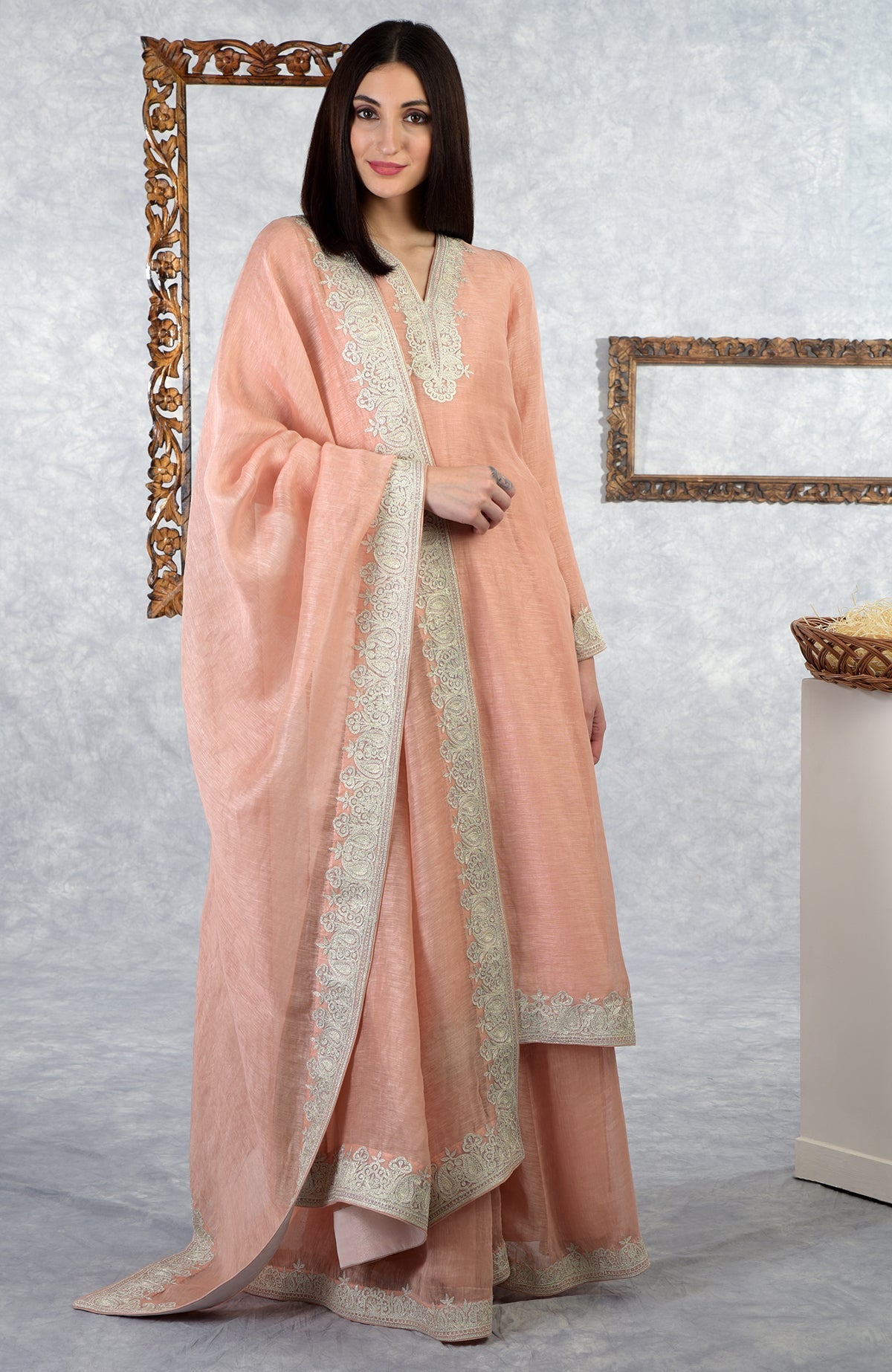 Pale peach Kashmiri Tilla embroidered kurta set with dupatta and sharara.
