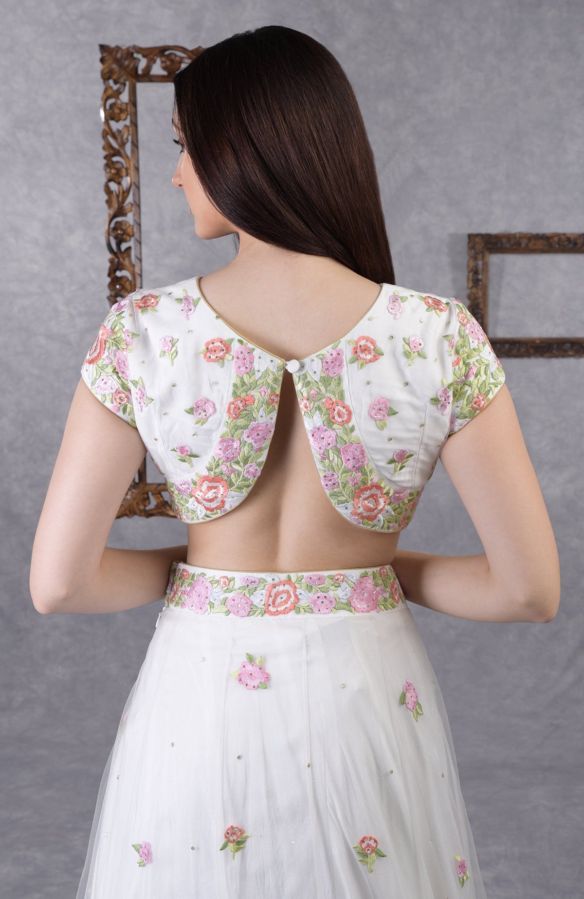 Pearl white lehenga set with pastel floral resham embroidery and sequin on blouse, skirt, and dupatta