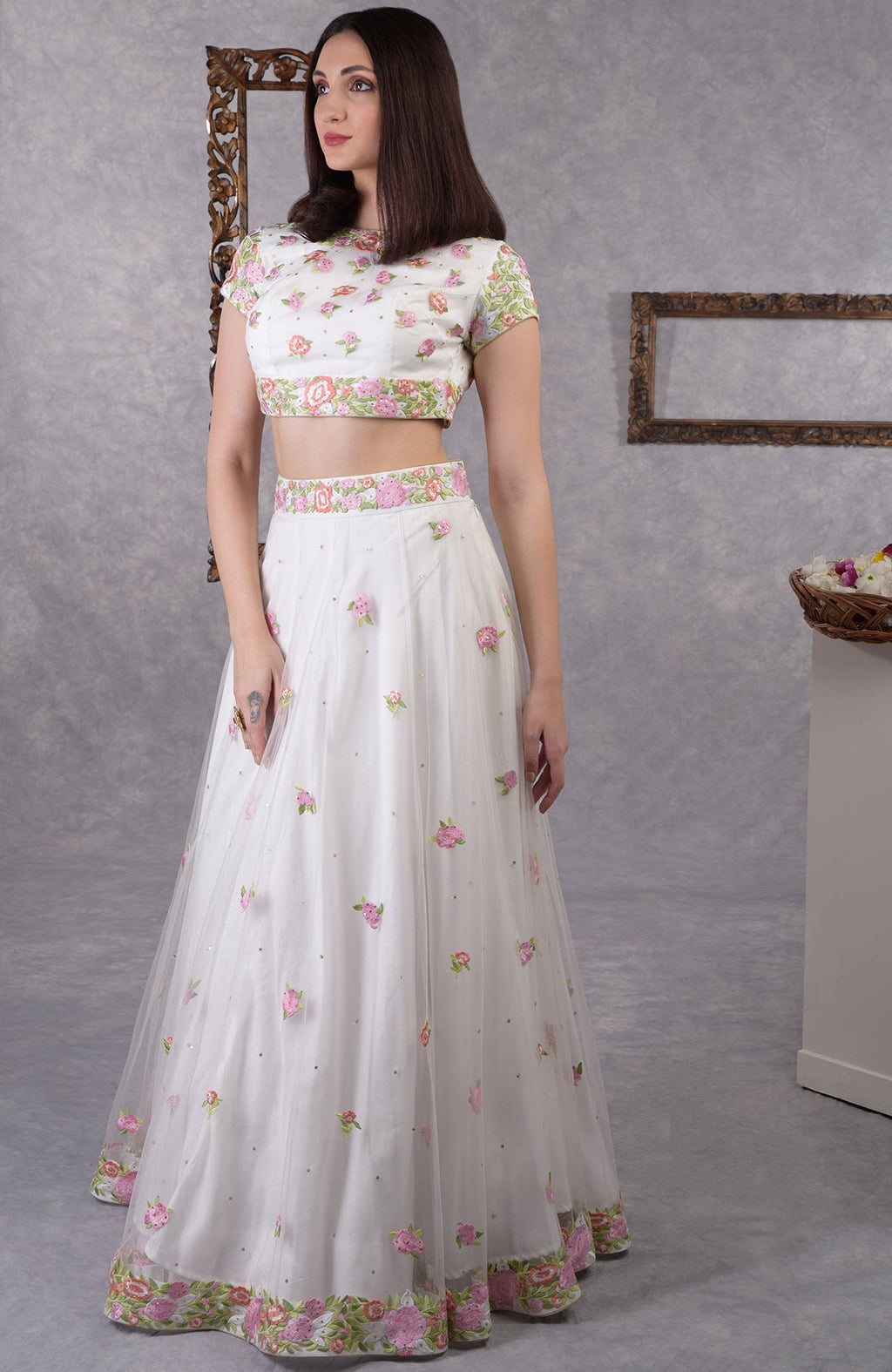 Pearl white lehenga set with pastel floral resham embroidery and sequin details with dupatta.