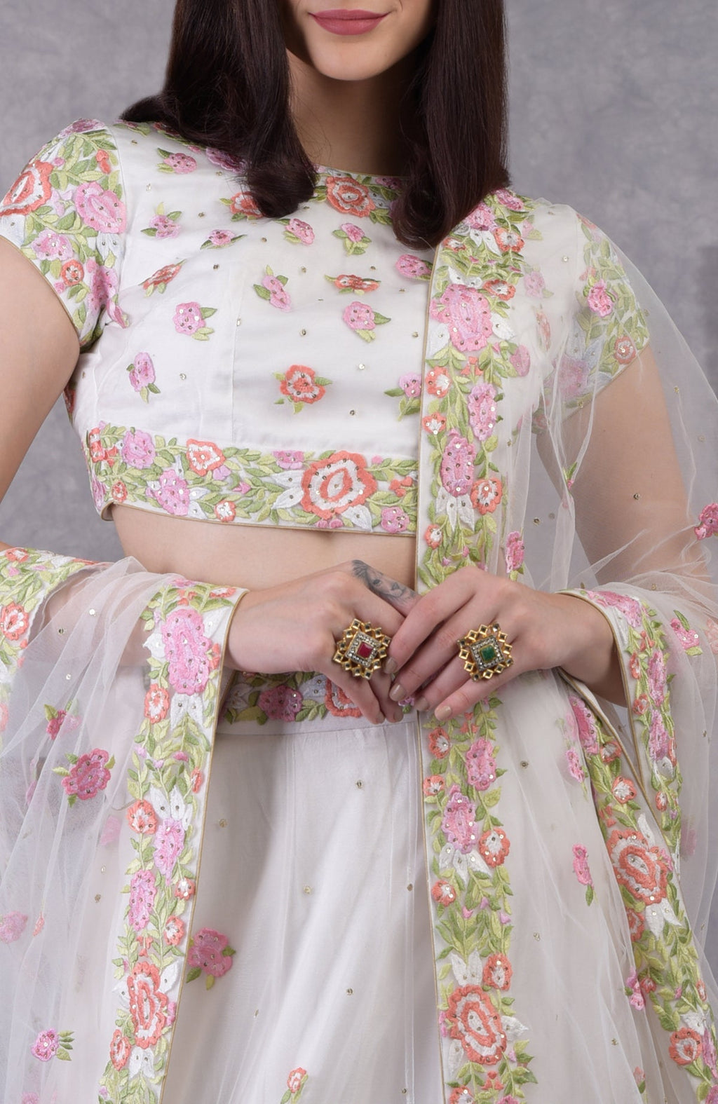 Pearl white lehenga set with pastel resham floral embroidery and sequin details, includes dupatta.