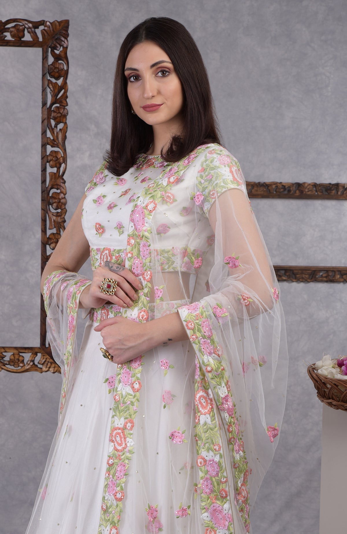 Pearl white lehenga set with pastel floral resham embroidery and sequin on blouse, skirt, and dupatta
