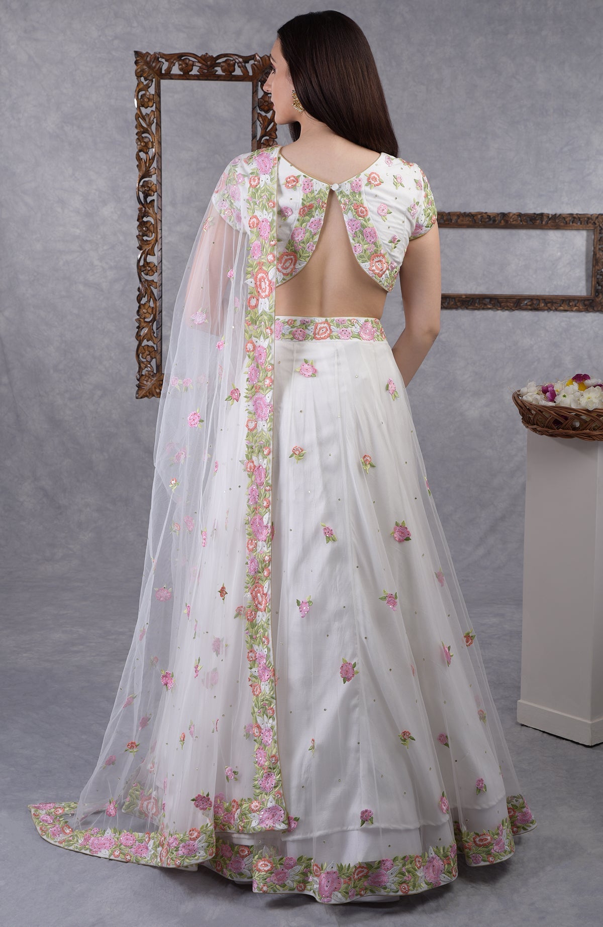 Pearl white lehenga set with pastel resham floral embroidery and sequin details, includes dupatta.