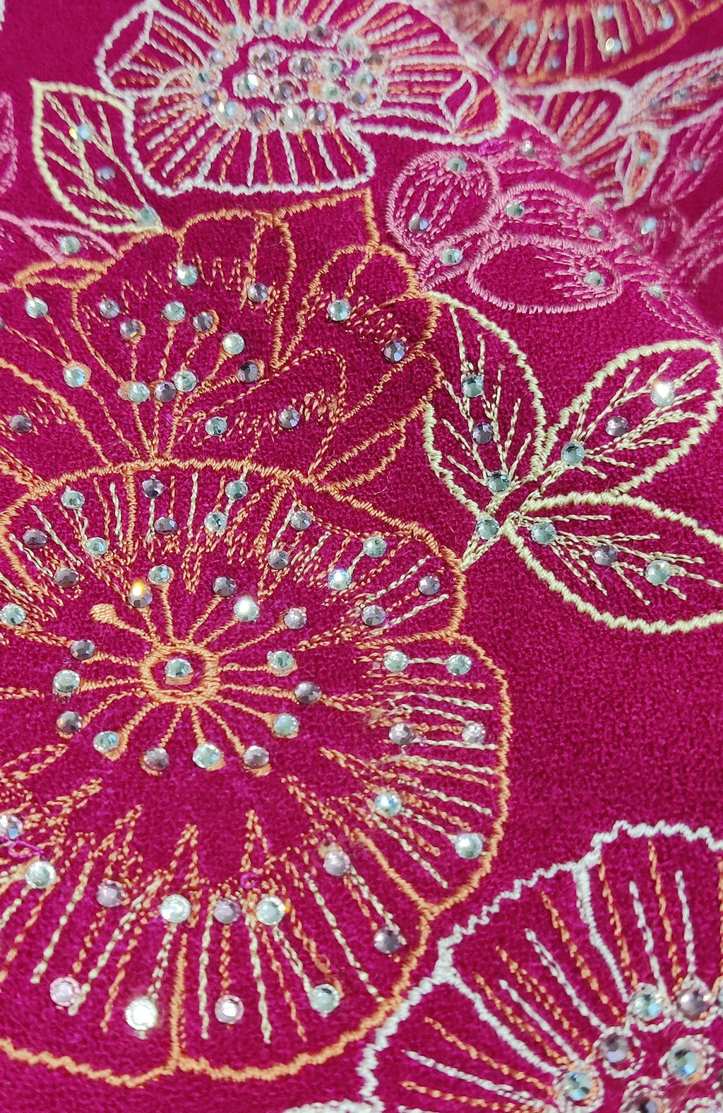 Fuchsia rose wool crepe jacket with floral embroidery and scattered Swarovski crystals.