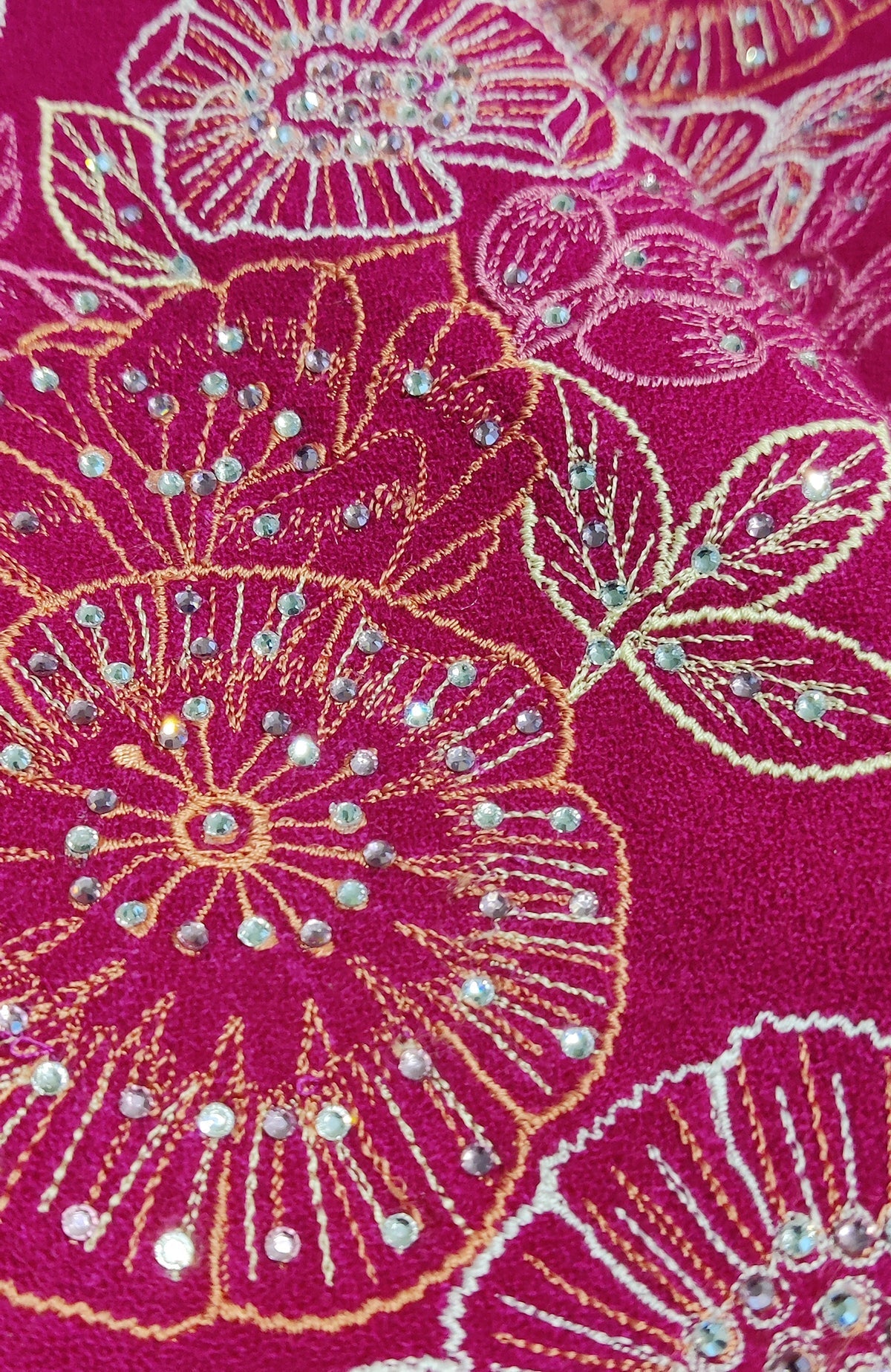Fuchsia rose wool crepe jacket with floral embroidery and scattered Swarovski crystals.