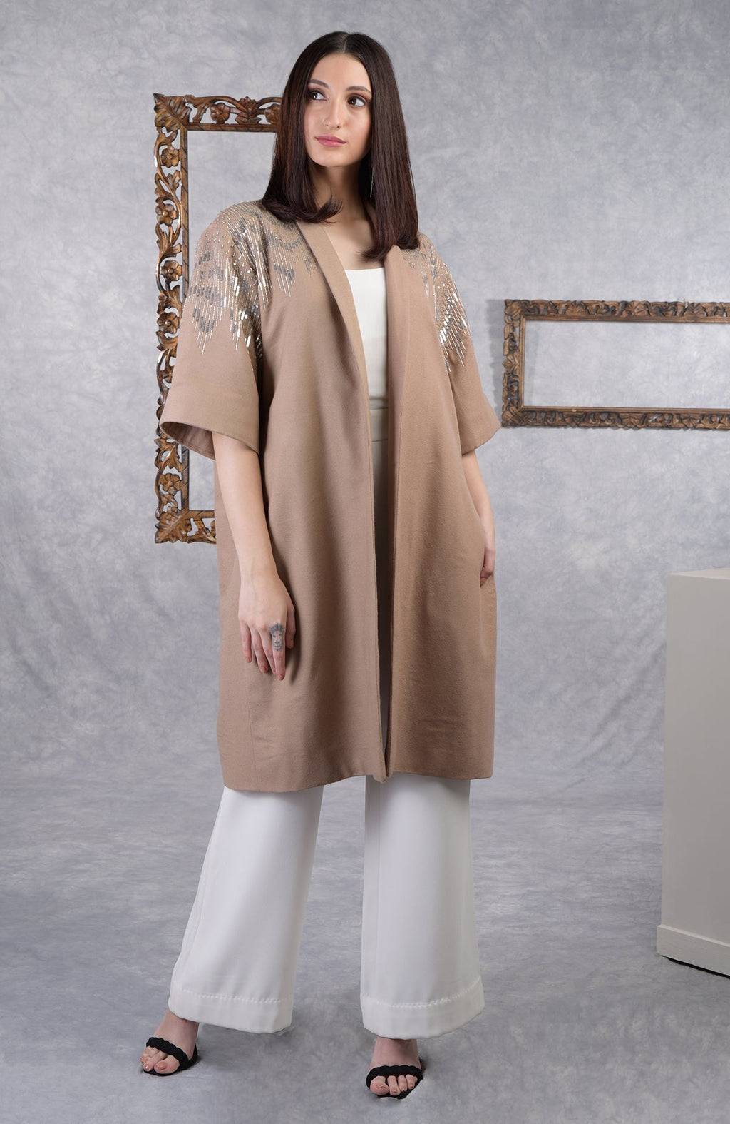 Camel beige wool crepe kimono jacket with silver sequin and cutbead embroidery and shawl collar.
