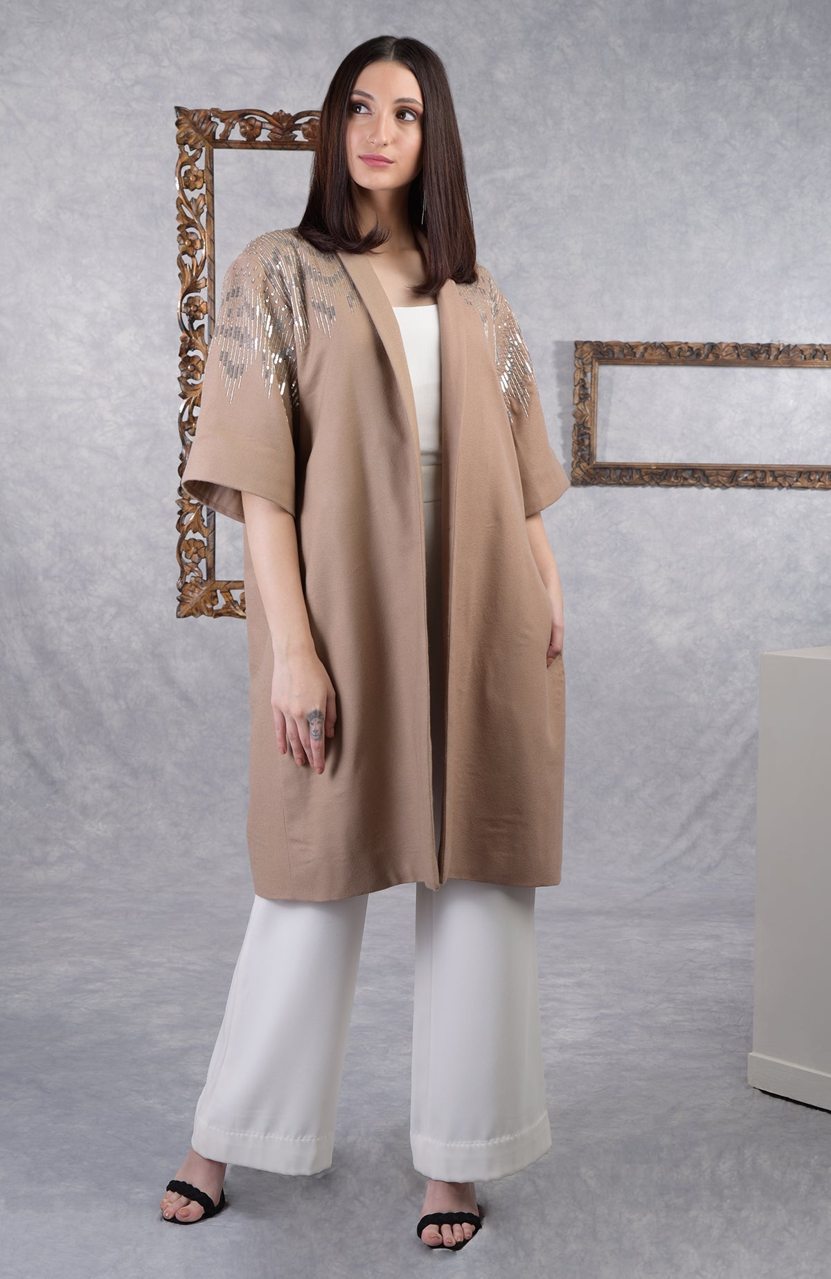 Camel beige wool crepe kimono jacket with silver sequin and cutbead embroidery and shawl collar.