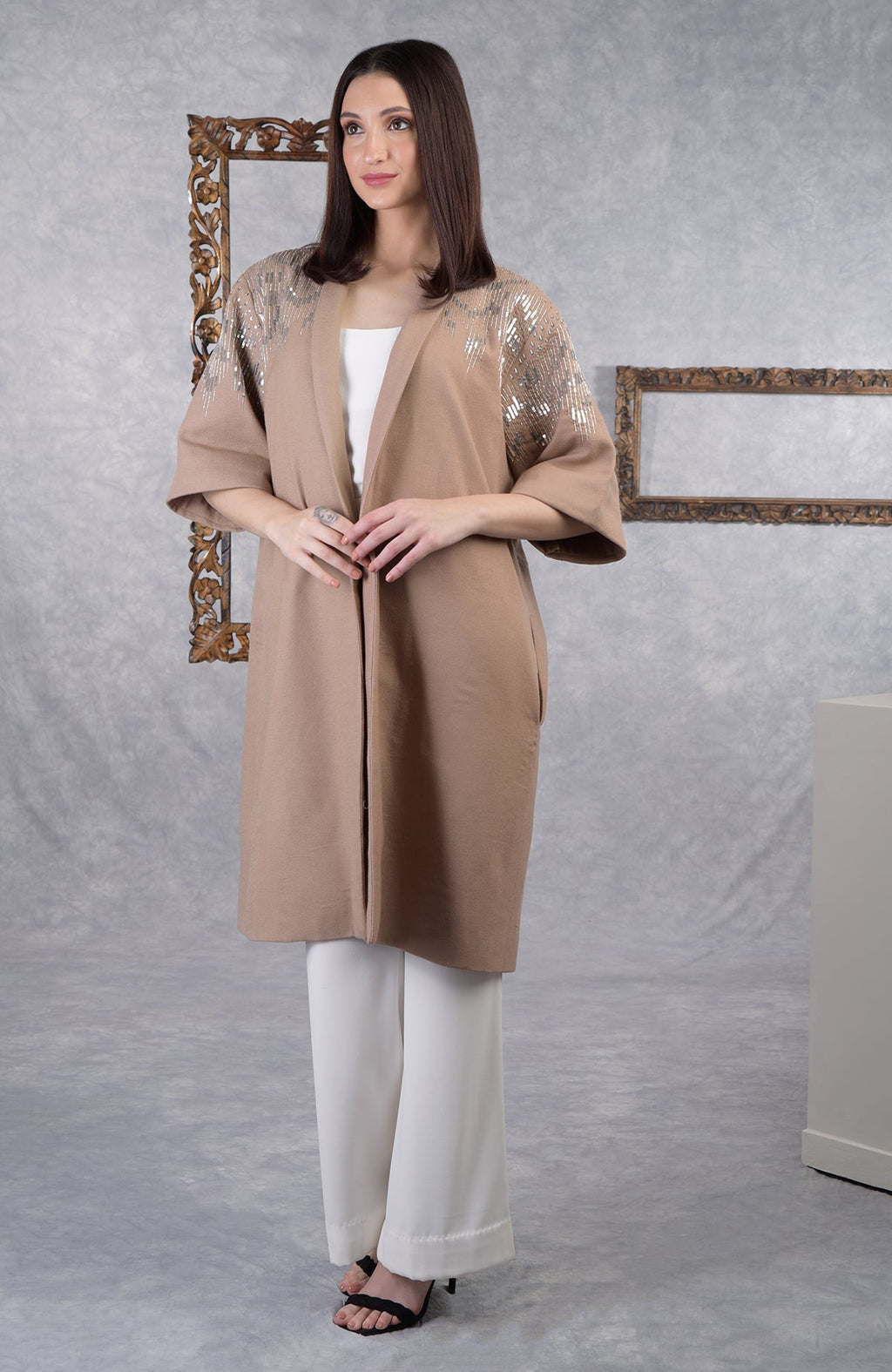Camel beige wool crepe kimono jacket with silver sequin and cutbead embroidery on shoulders.