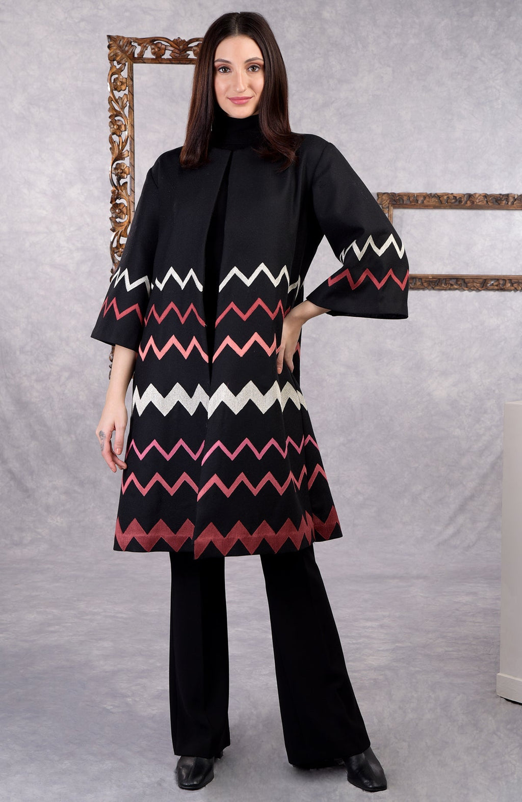 Black wool crepe jacket with chevron embroidery and 3/4 bell sleeves in copper and pink tones