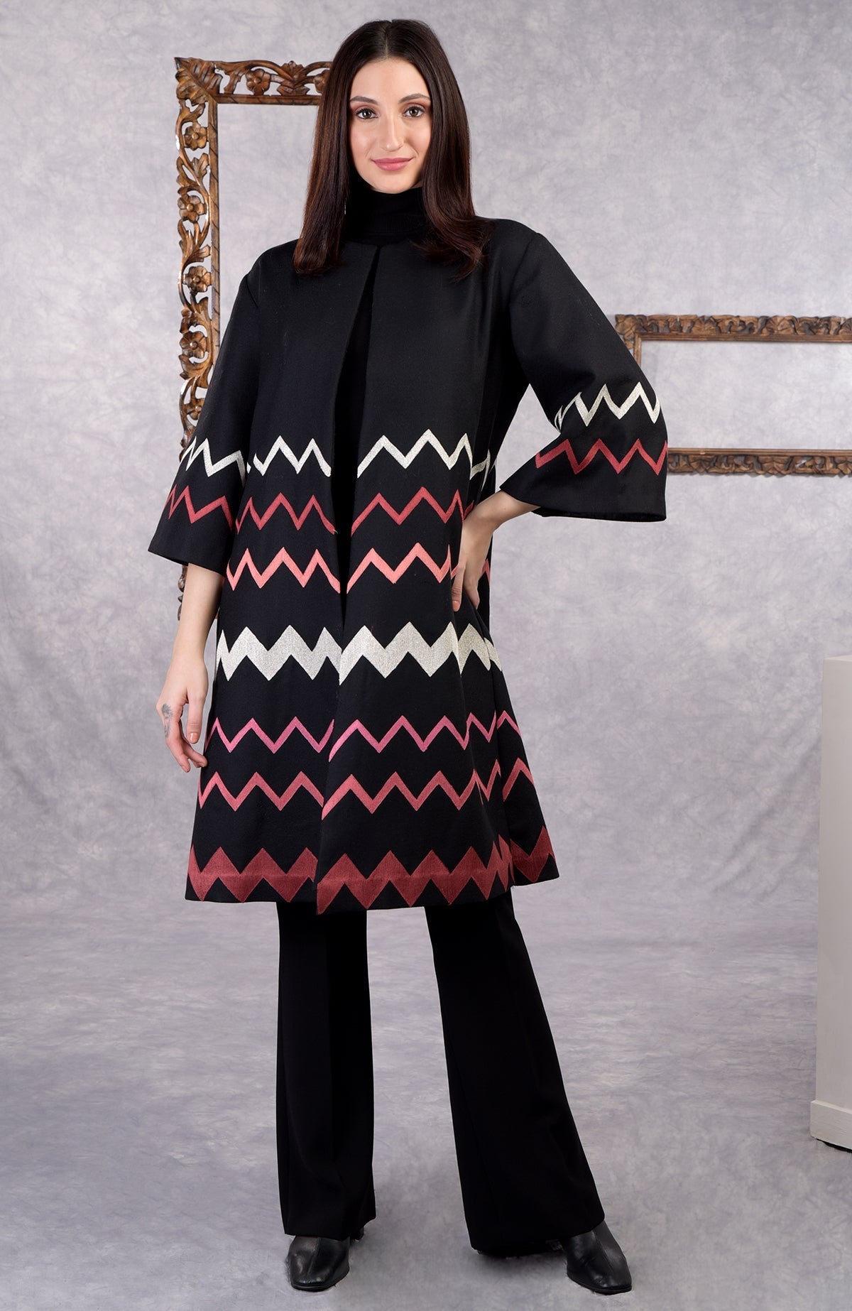 Black wool crepe jacket with chevron embroidery and 3/4 bell sleeves in copper and pink tones