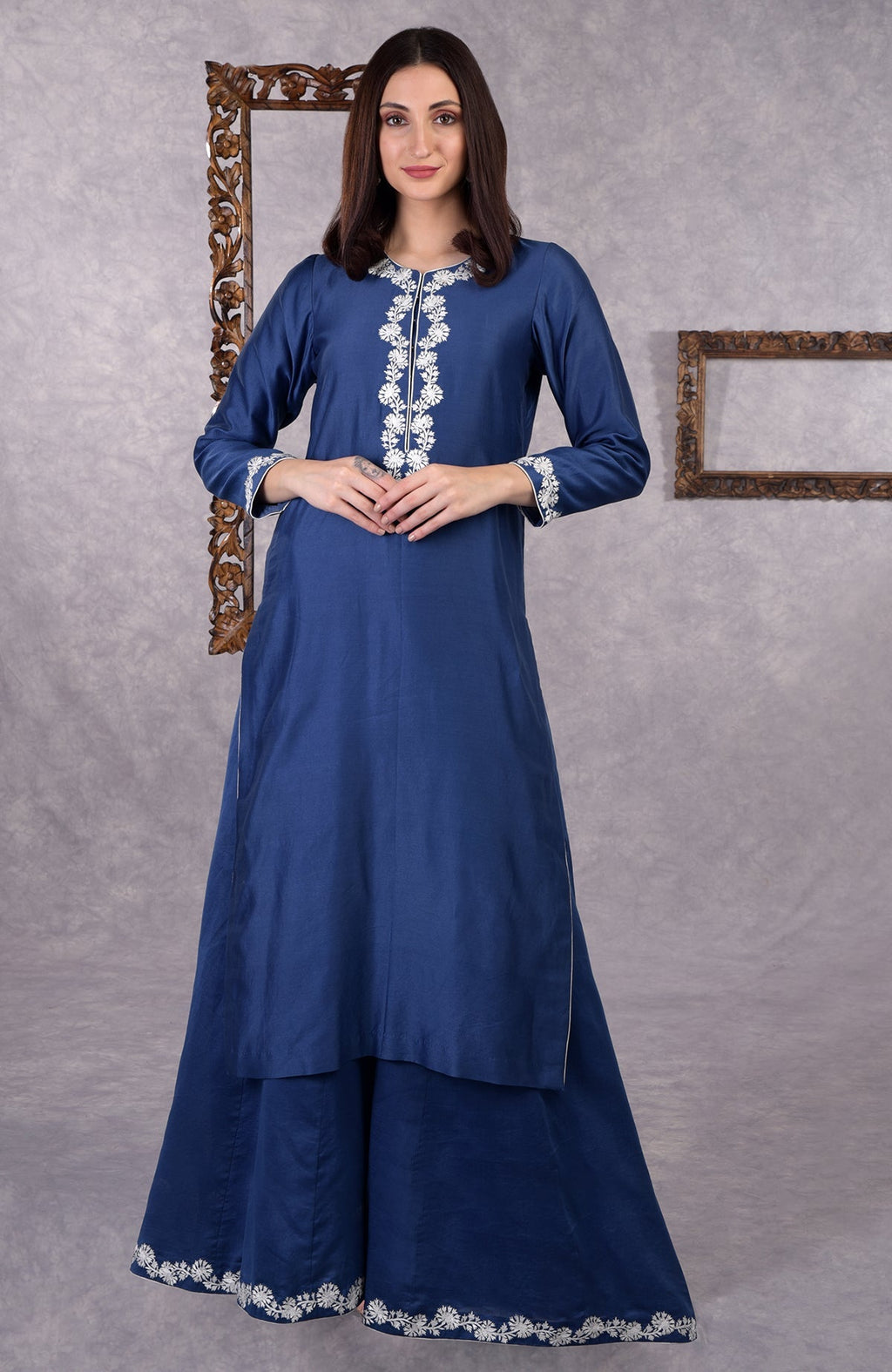 Classic blue chanderi sharara suit with white Kashmir Bagh inspired thread embroidery and dupatta.