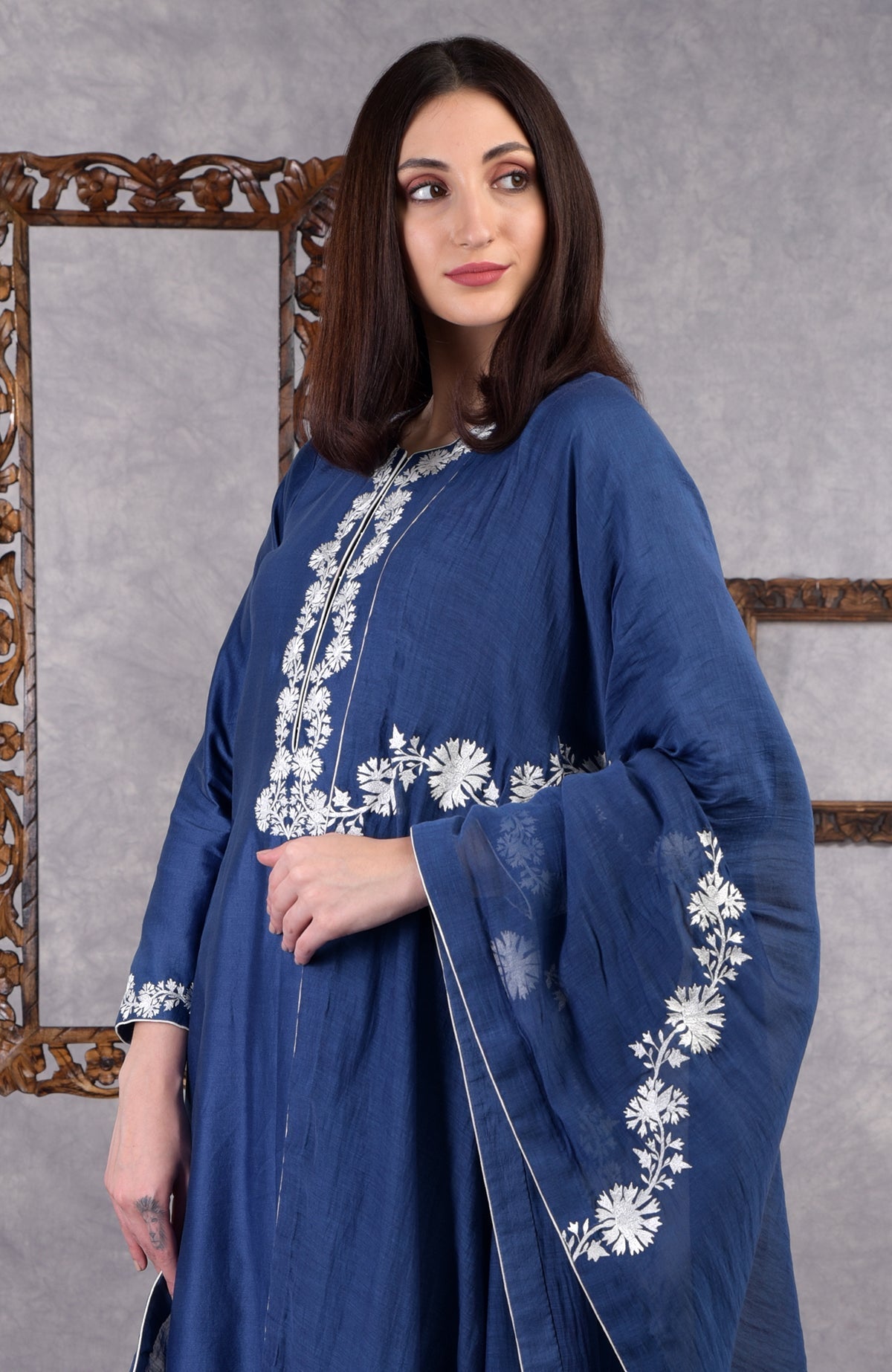 Classic blue chanderi sharara suit with white Kashmir Bagh thread embroidery and matching dupatta.