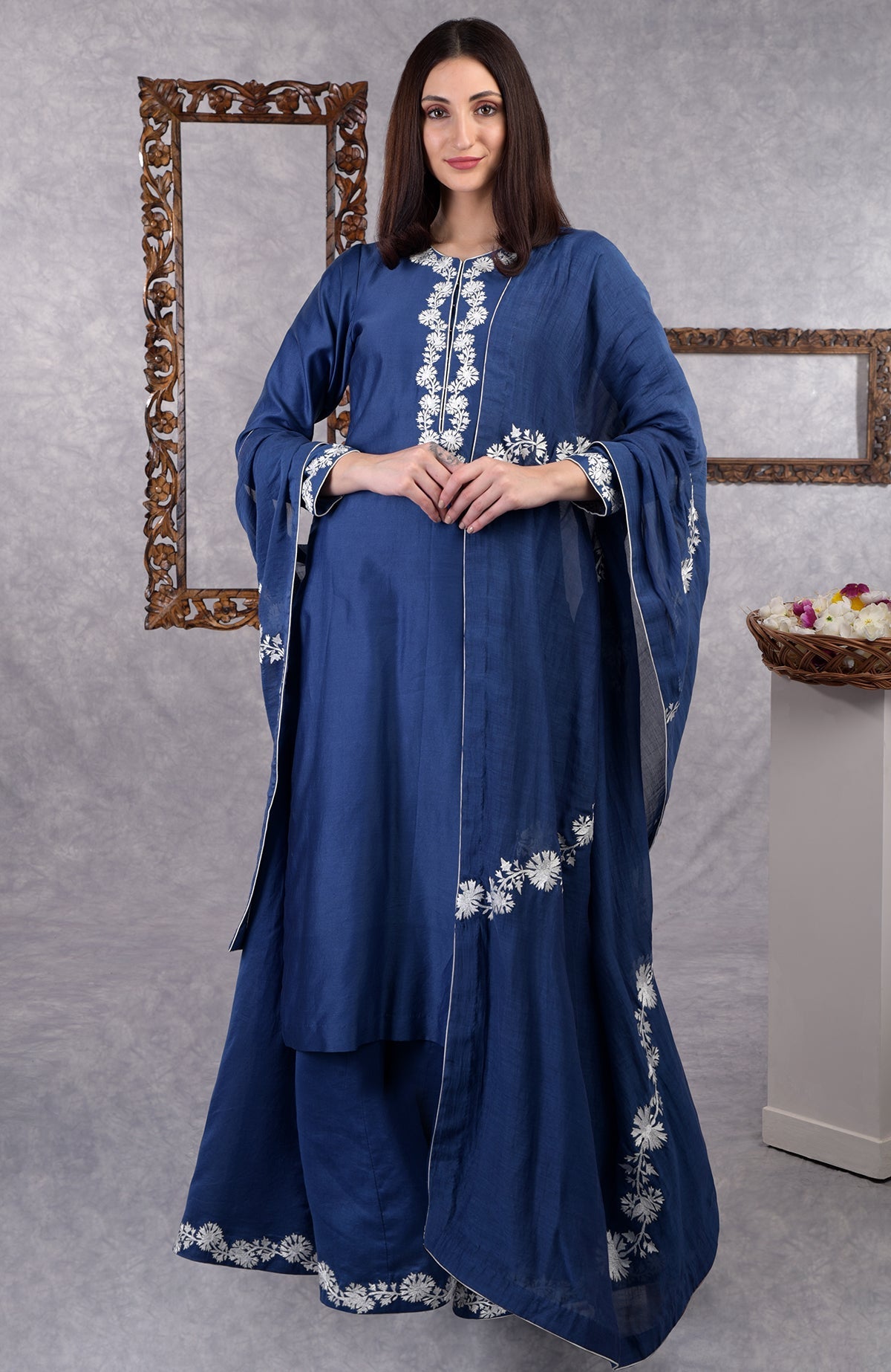 Classic blue chanderi sharara suit with white Kashmir Bagh inspired thread embroidery and dupatta.