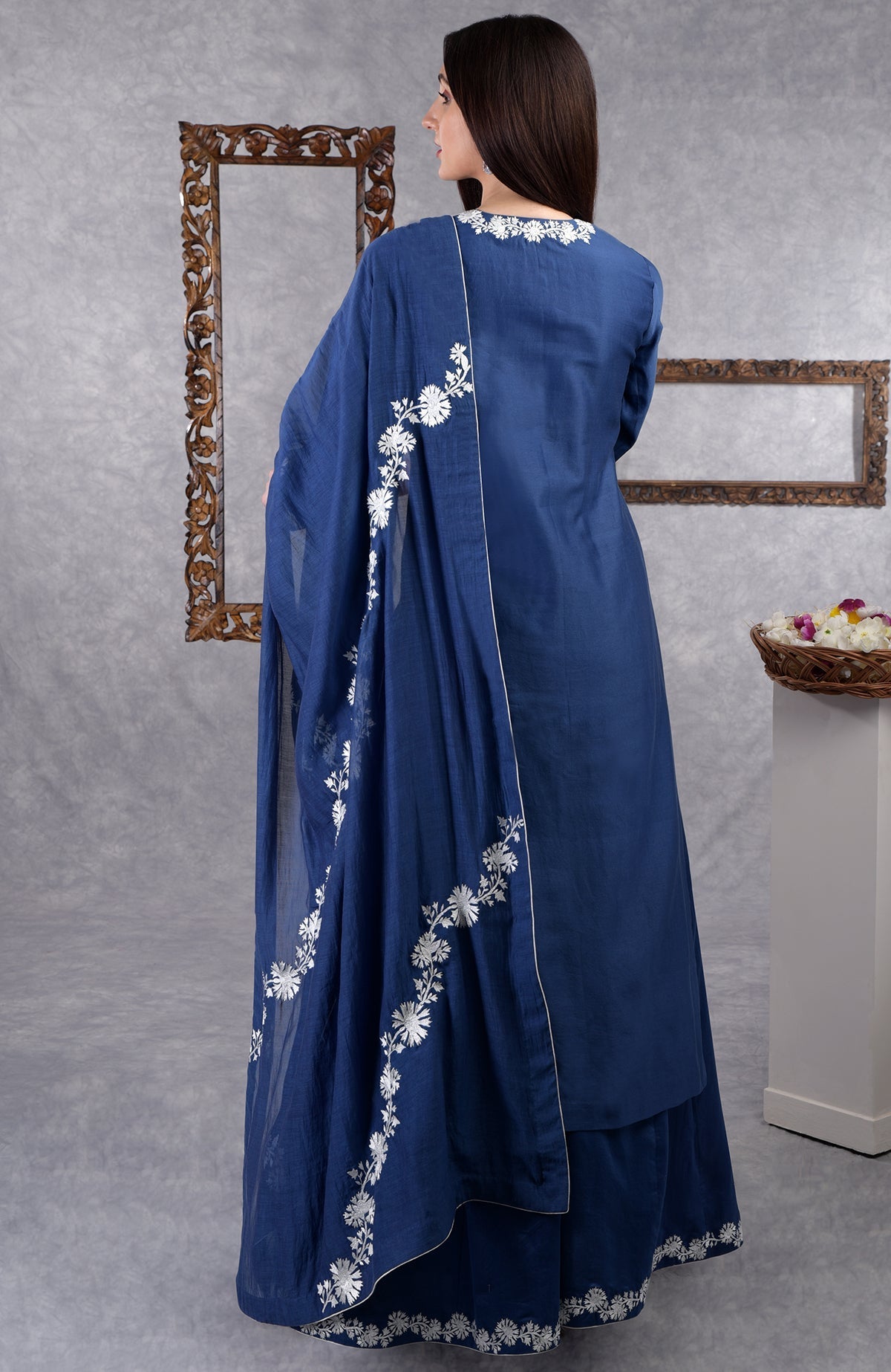 Classic blue chanderi sharara suit with white Kashmir Bagh inspired thread embroidery and dupatta.