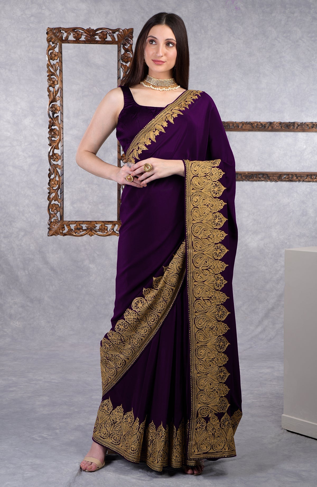 Teal crepe saree with gold Kashmiri tilla aari floral and paisley embroidery on border