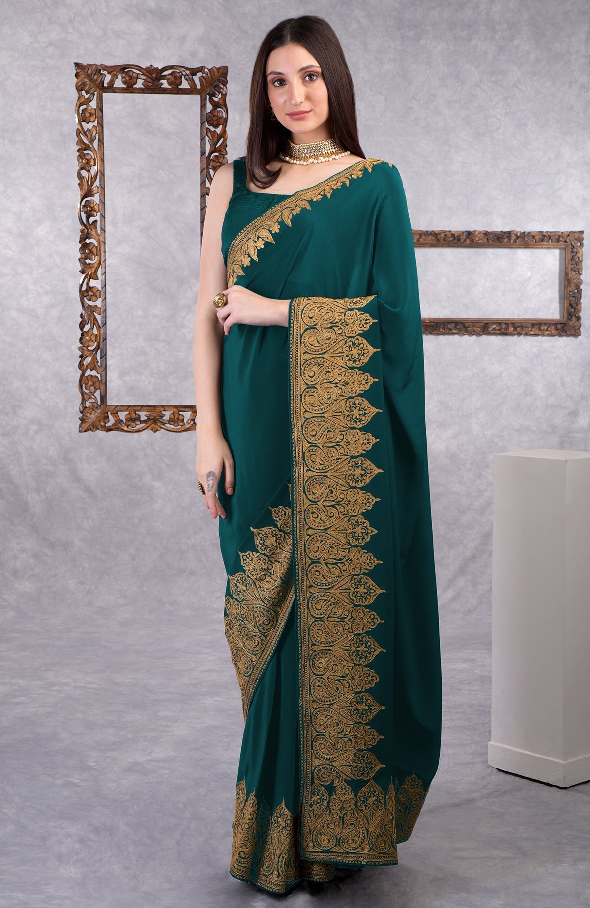 Teal crepe saree with gold Kashmiri tilla aari floral and paisley embroidery border