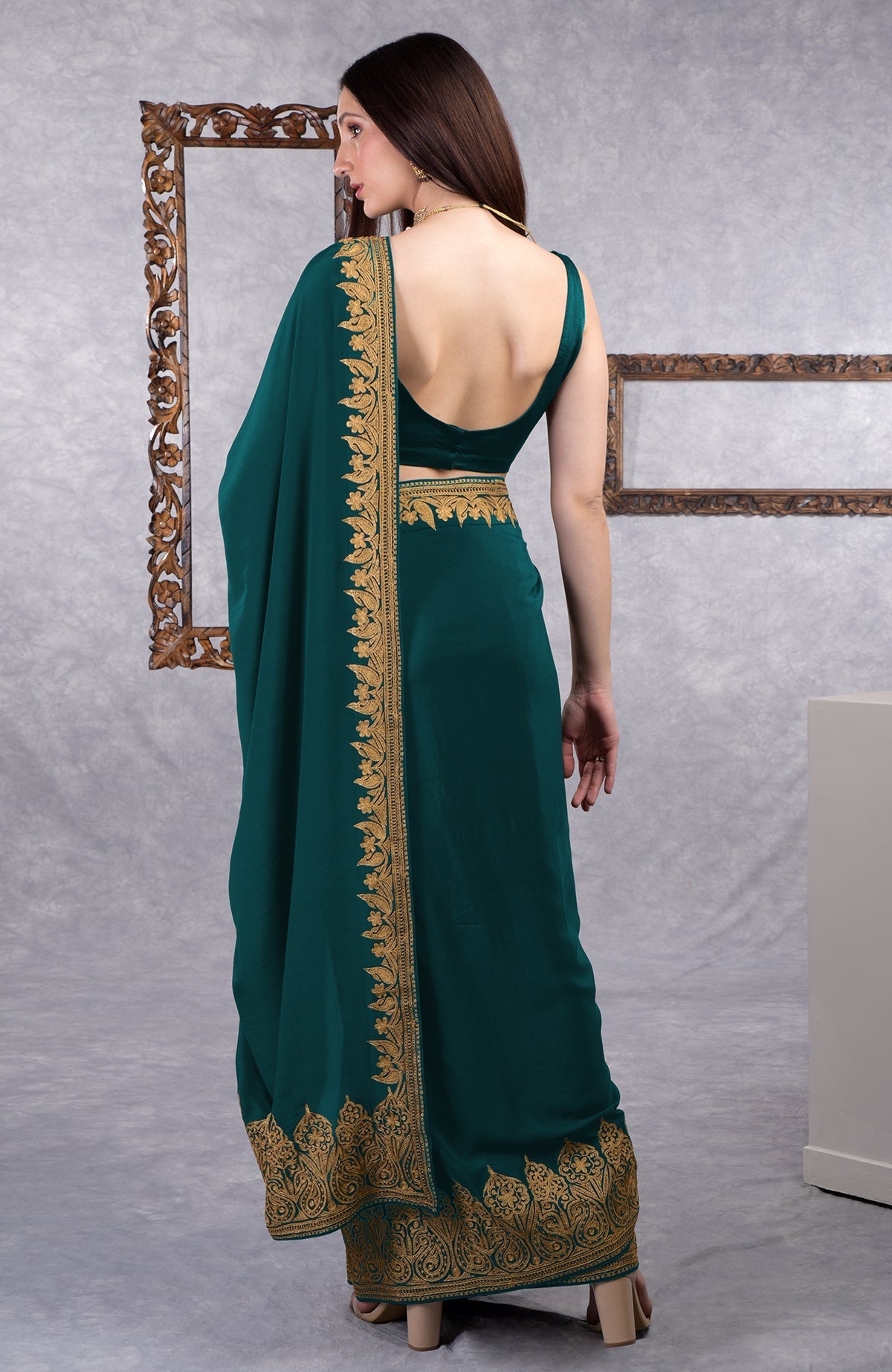 Teal crepe saree with gold Kashmiri tilla aari floral and paisley embroidery on border