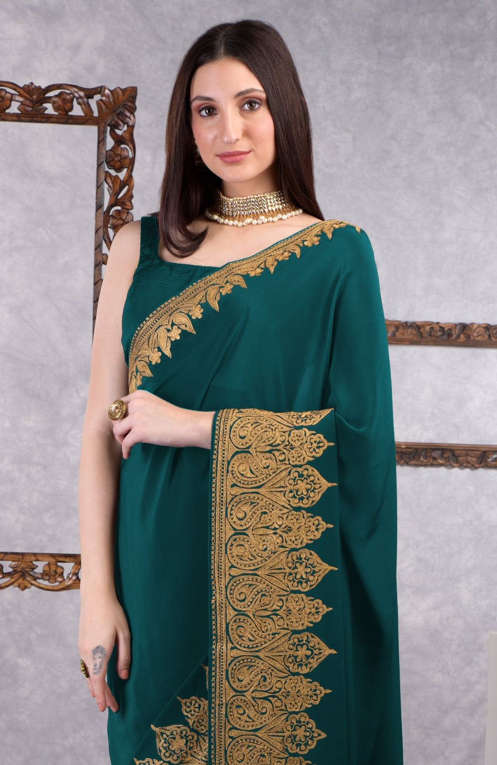 Teal crepe saree with gold Kashmiri tilla aari floral and paisley embroidery border