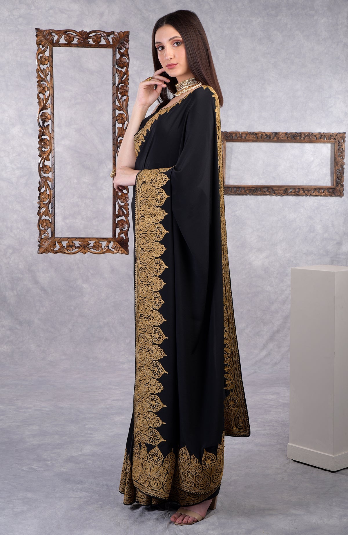 Black crepe saree with gold Kashmiri tilla aari floral and paisley embroidery border