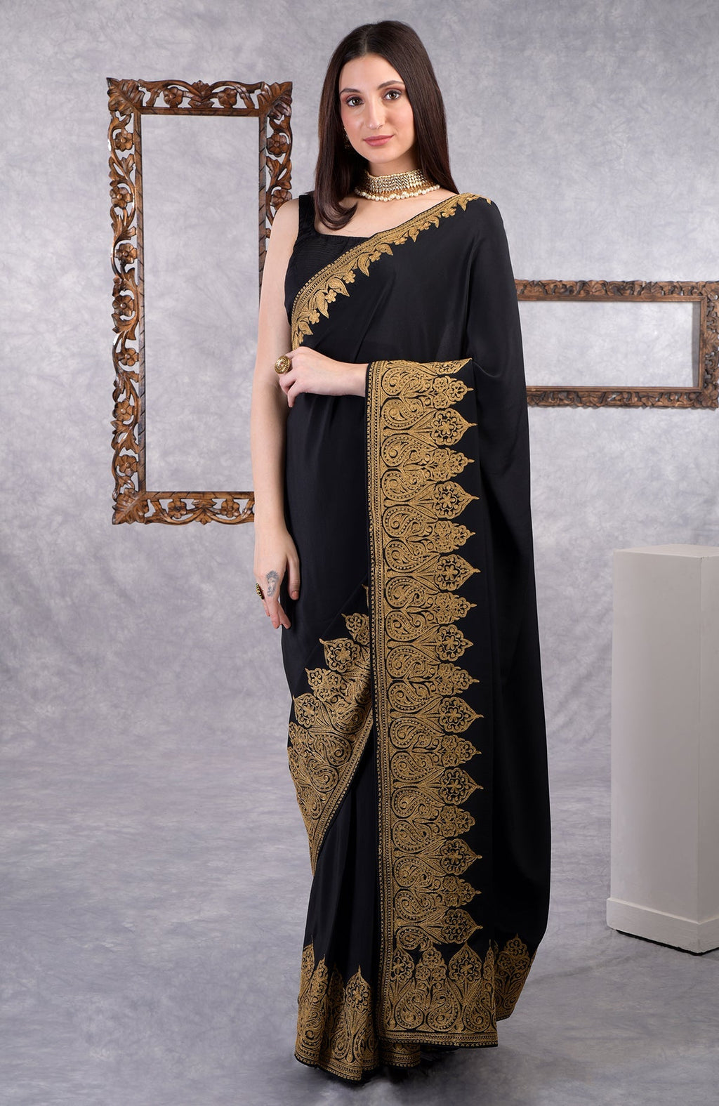 Black crepe saree with gold Kashmiri tilla aari floral and paisley embroidery border