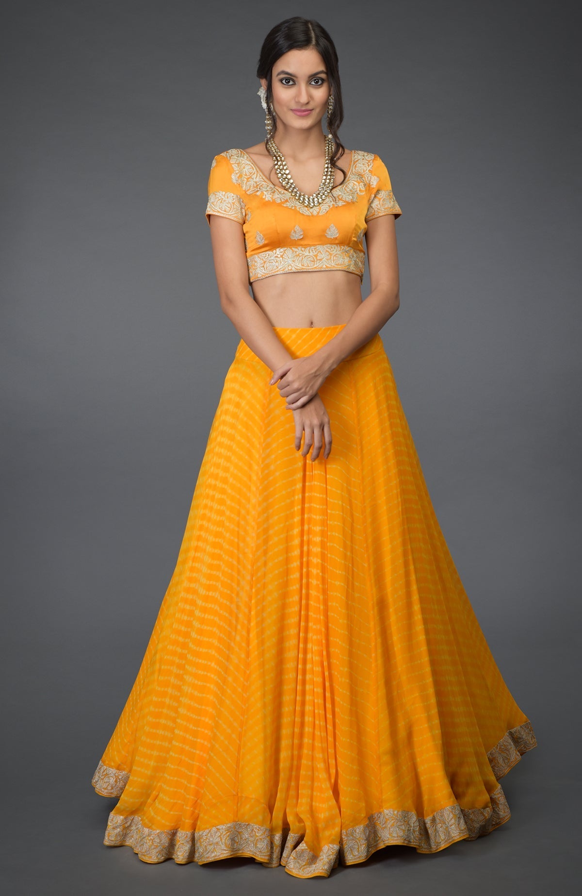 Yellow chiffon lehenga set with silver tilla embroidery and satin silk blouse with cap sleeves