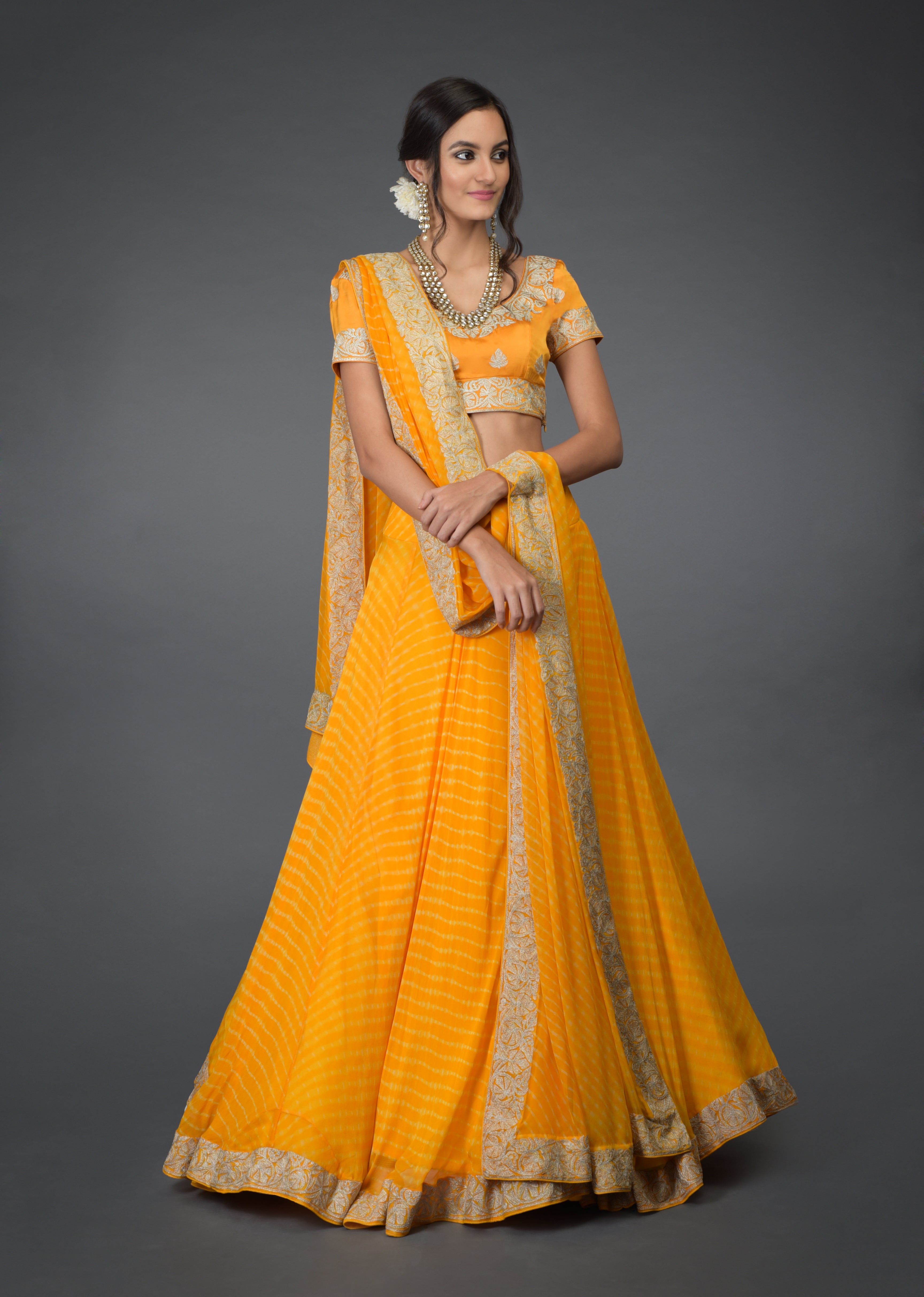 Yellow chiffon leheriya lehenga set with silver tilla embroidery and satin silk blouse