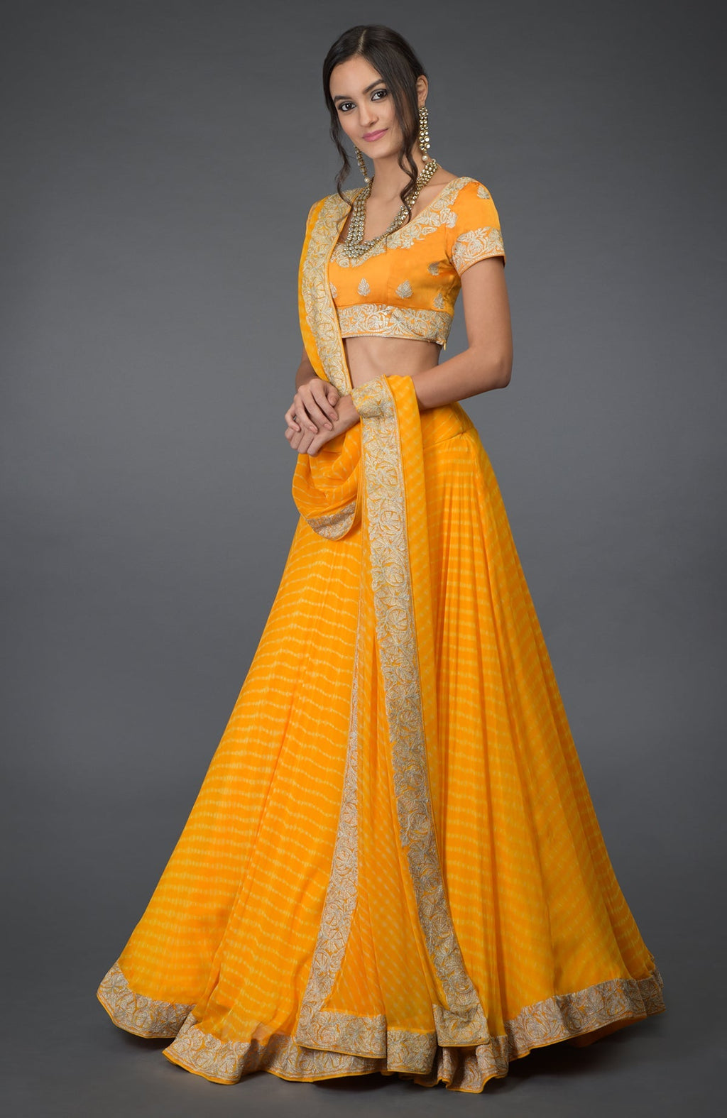 Yellow chiffon lehenga set with silver tilla embroidery and satin silk blouse with cap sleeves