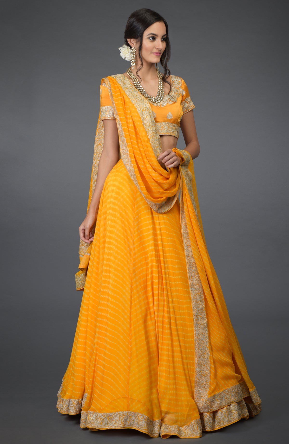 Yellow leheriya lehenga set with silver tilla embroidery and chiffon dupatta and satin blouse