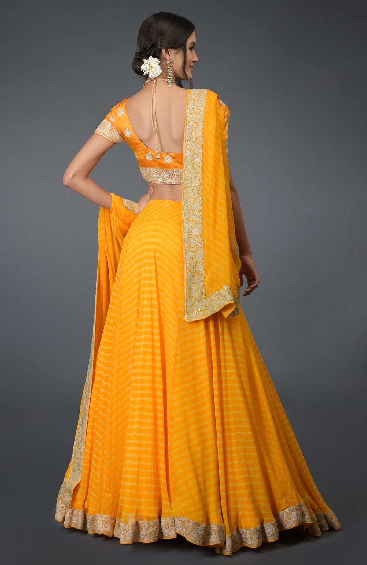 Yellow chiffon lehenga set with silver tilla embroidery and satin silk blouse with cap sleeves