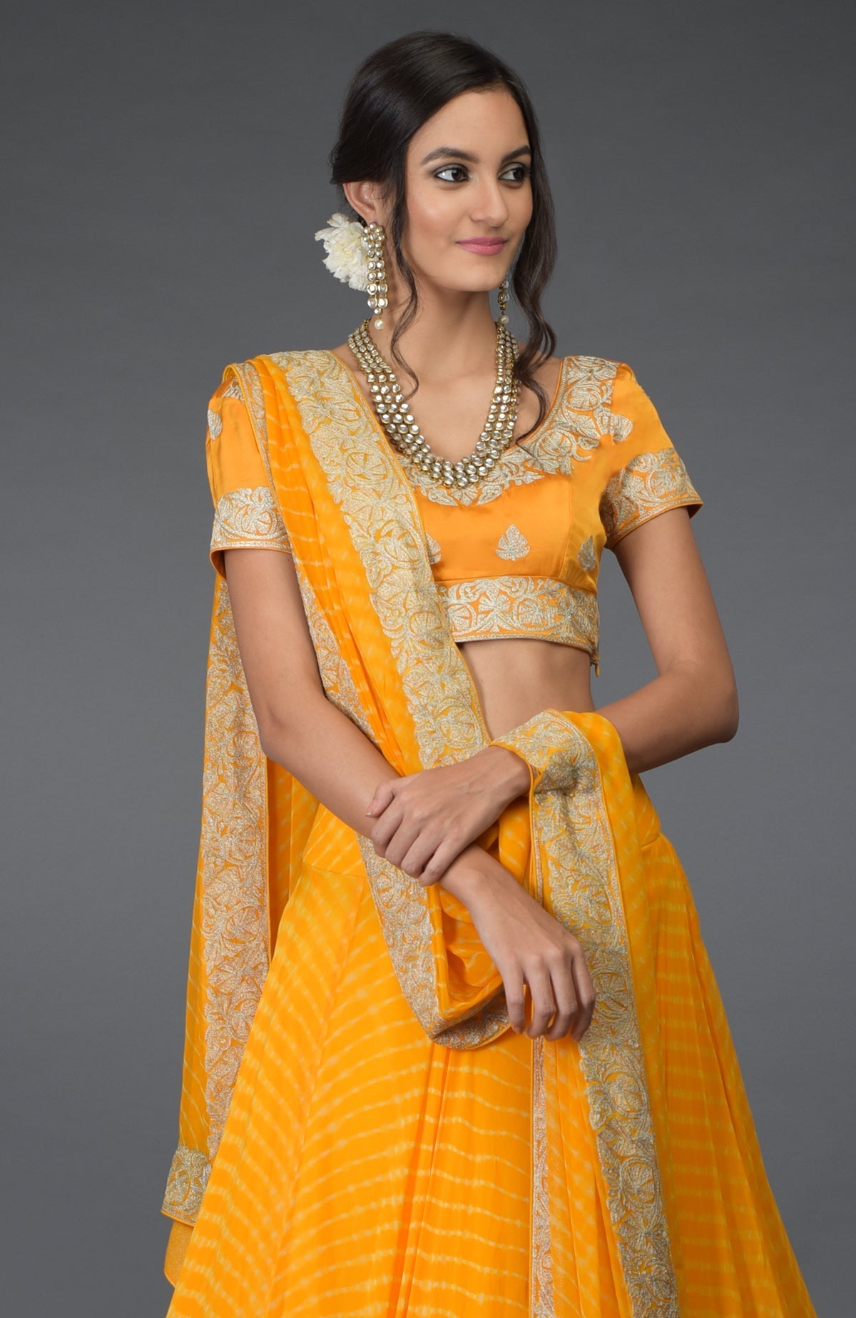 Yellow chiffon leheriya lehenga set with silver tilla embroidery and satin silk blouse