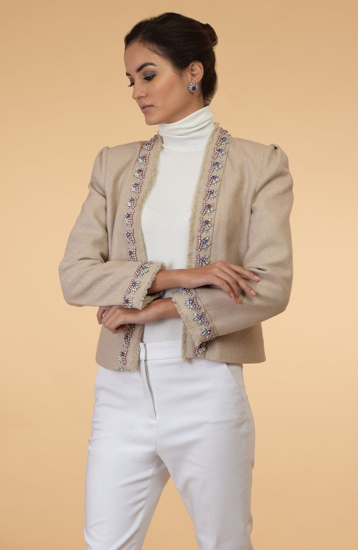 Beige cropped tweed jacket with long sleeves and purple, pink, silver crystal embroidery details