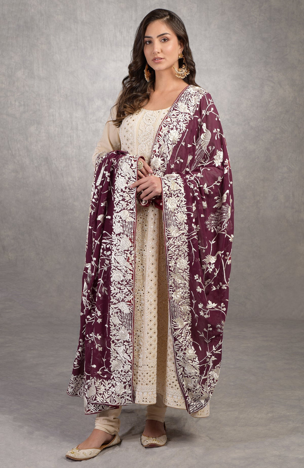 Ruby wine georgette dupatta with ivory Parsi Gara embroidery paired with champagne Chikankari Anarkali suit.