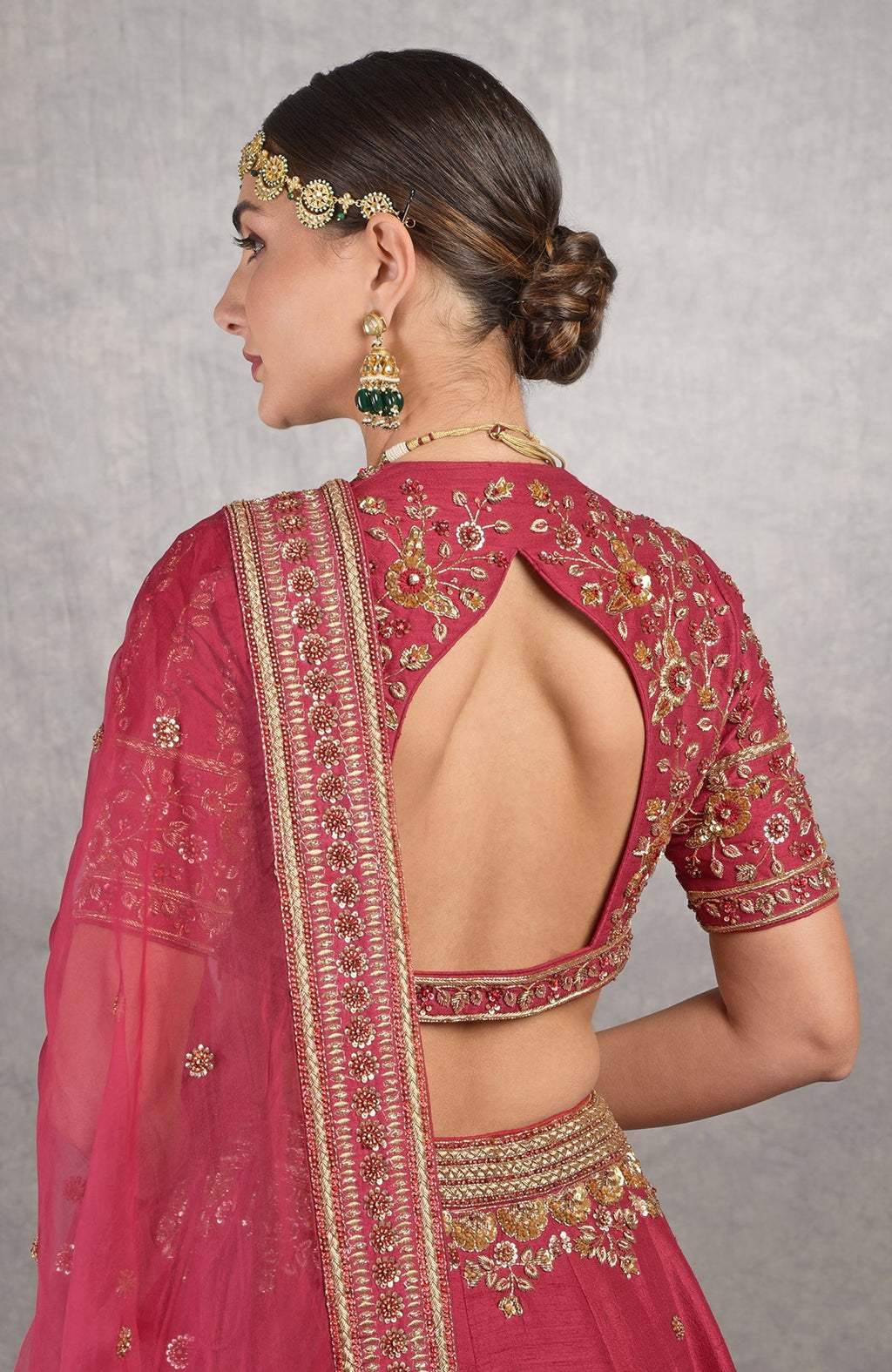 Red raw silk blouse with gold zardozi floral embroidery and fitted sleeves