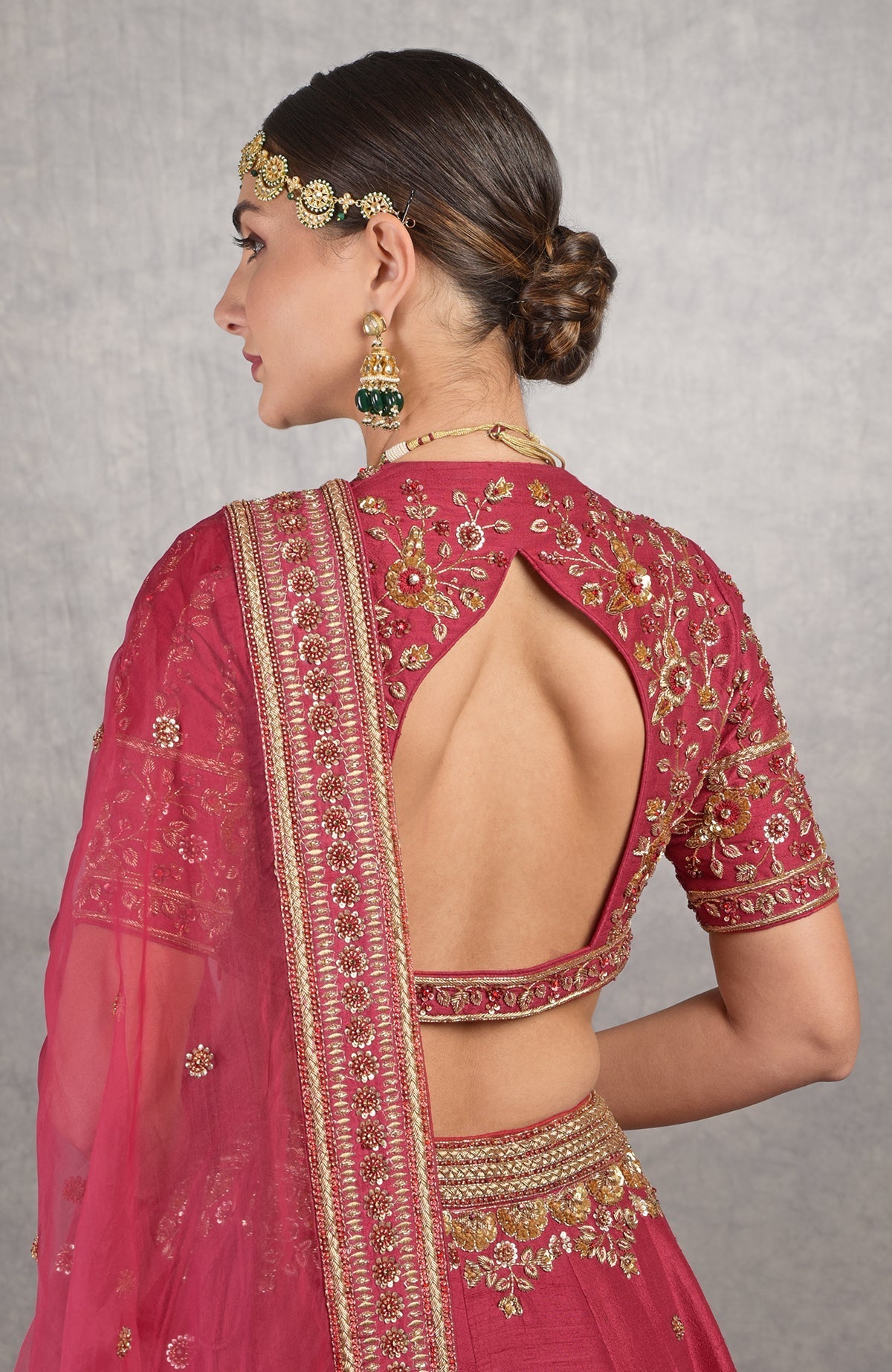 Red raw silk blouse with gold zardozi floral embroidery and fitted sleeves