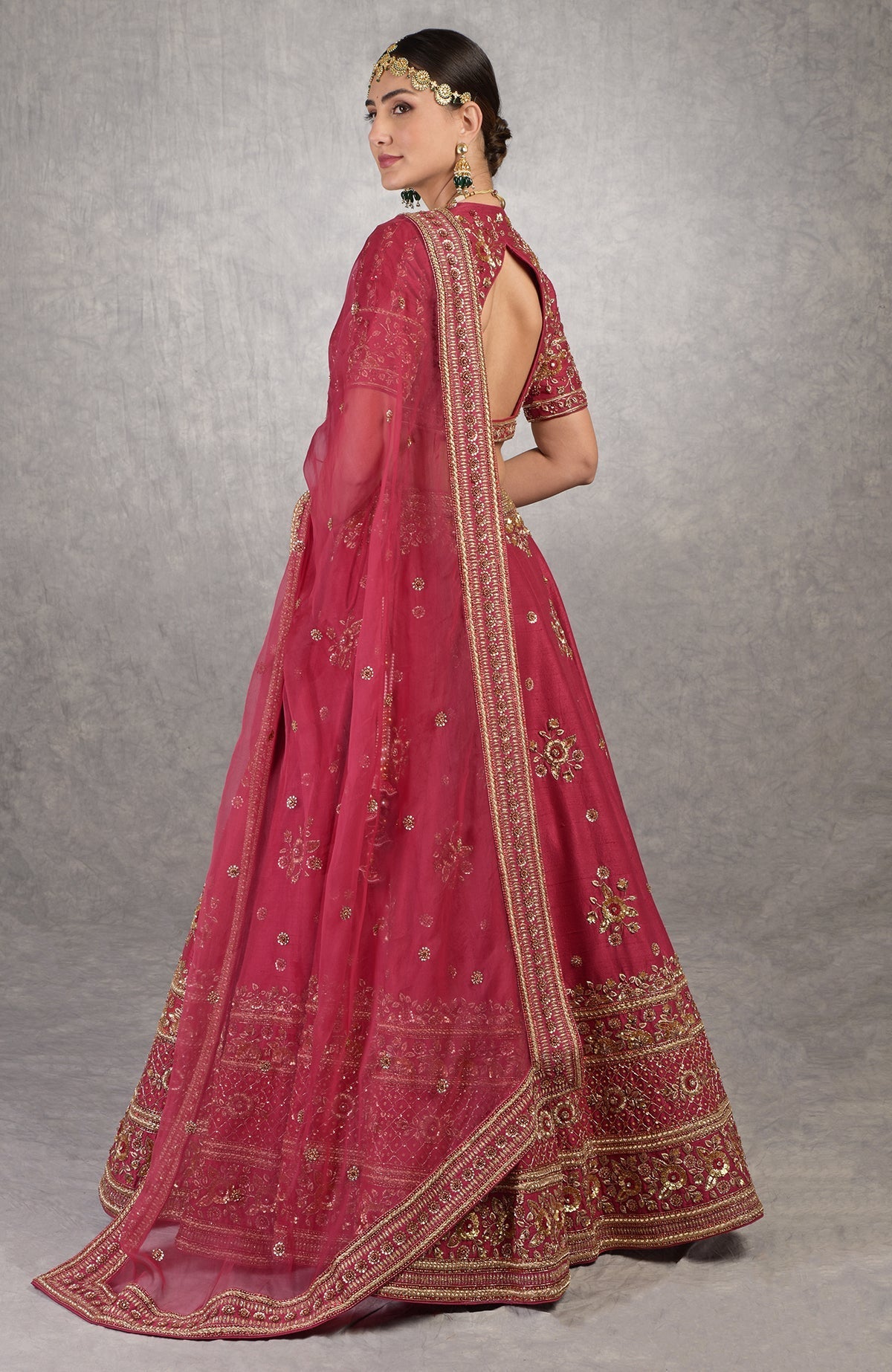 Deep red lehenga set with gold zardozi floral embroidery and matching silk organza veil.