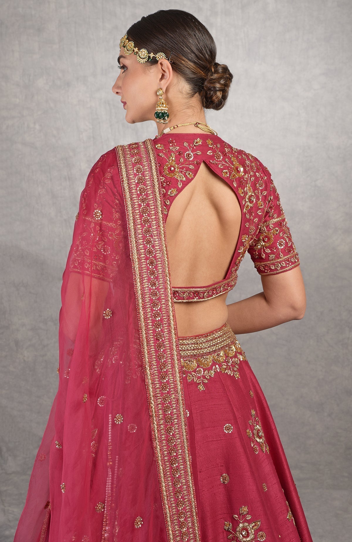Red raw silk lehenga set with gold zardozi floral embroidery and matching silk organza dupatta.