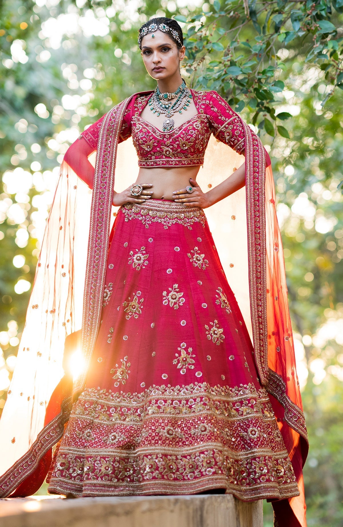 Red raw silk lehenga set with gold zardozi floral embroidery and matching silk organza dupatta.