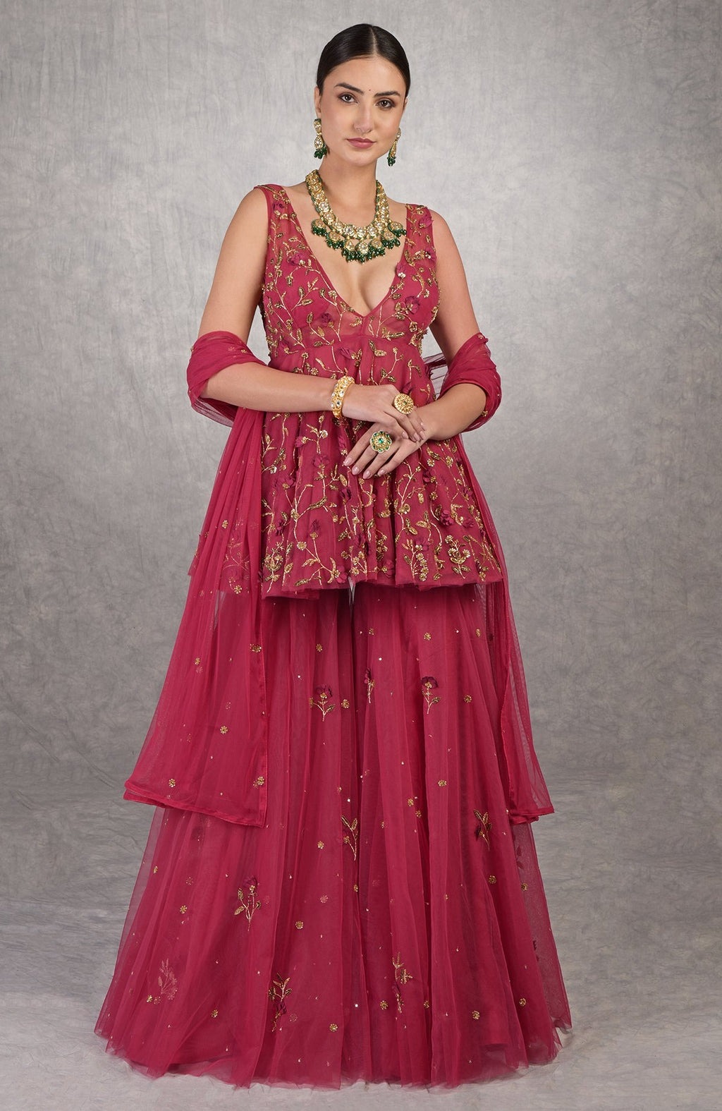 Red sharara set with 3-D floral and zardozi hand embroidery on soft tulle fabric.