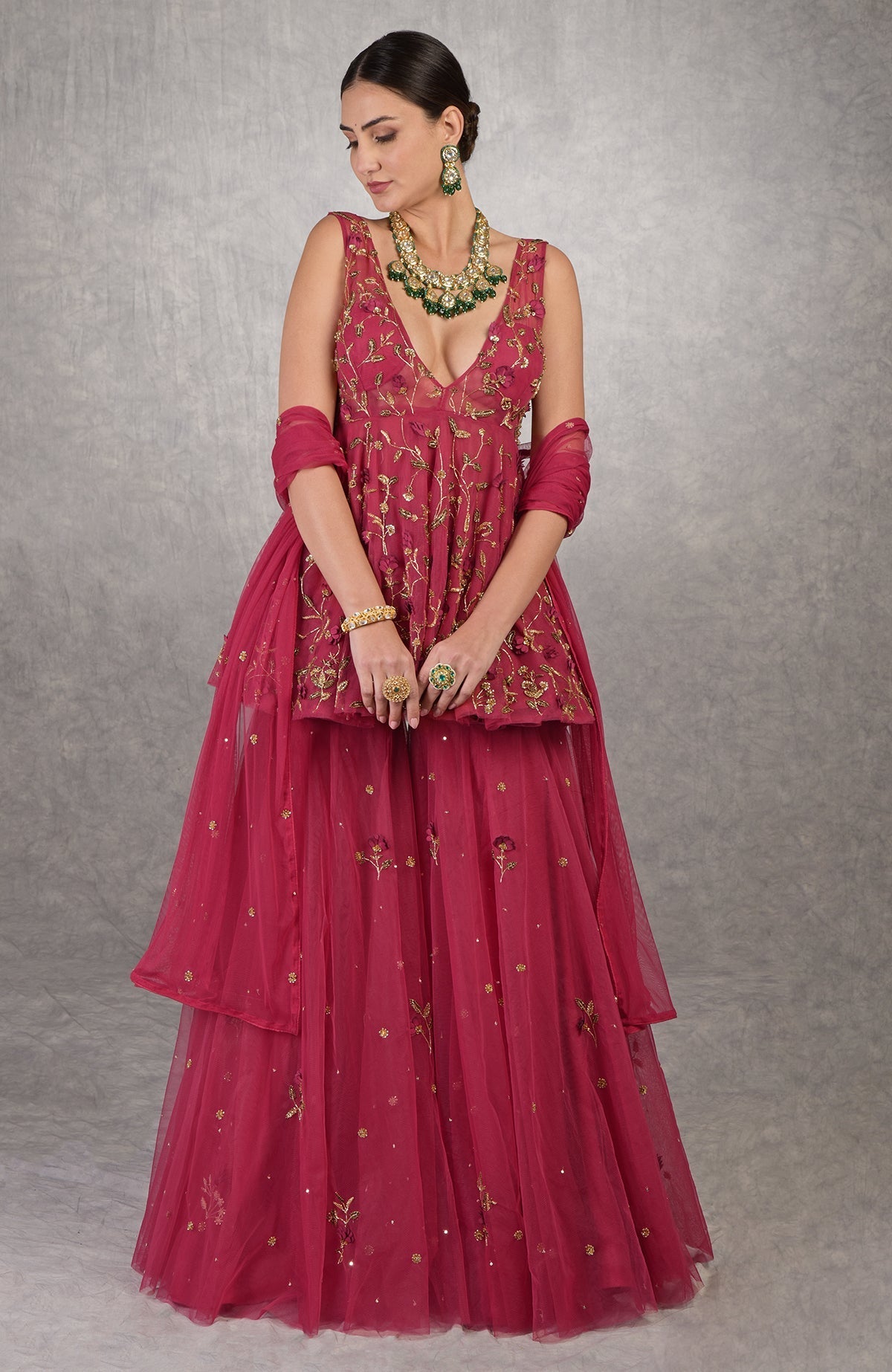 Red sharara set with 3D floral and gold hand embroidery on soft tulle fabric.