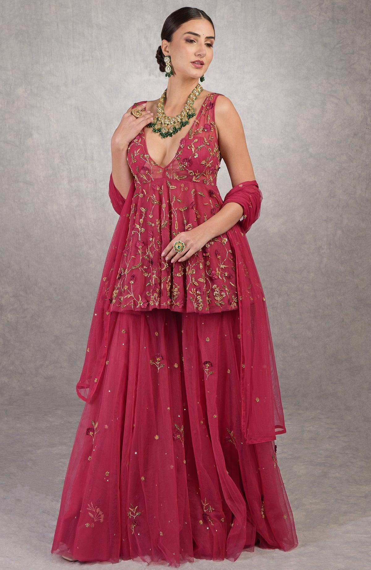 Red sharara set with 3-D floral and zardozi hand embroidery on soft tulle fabric.