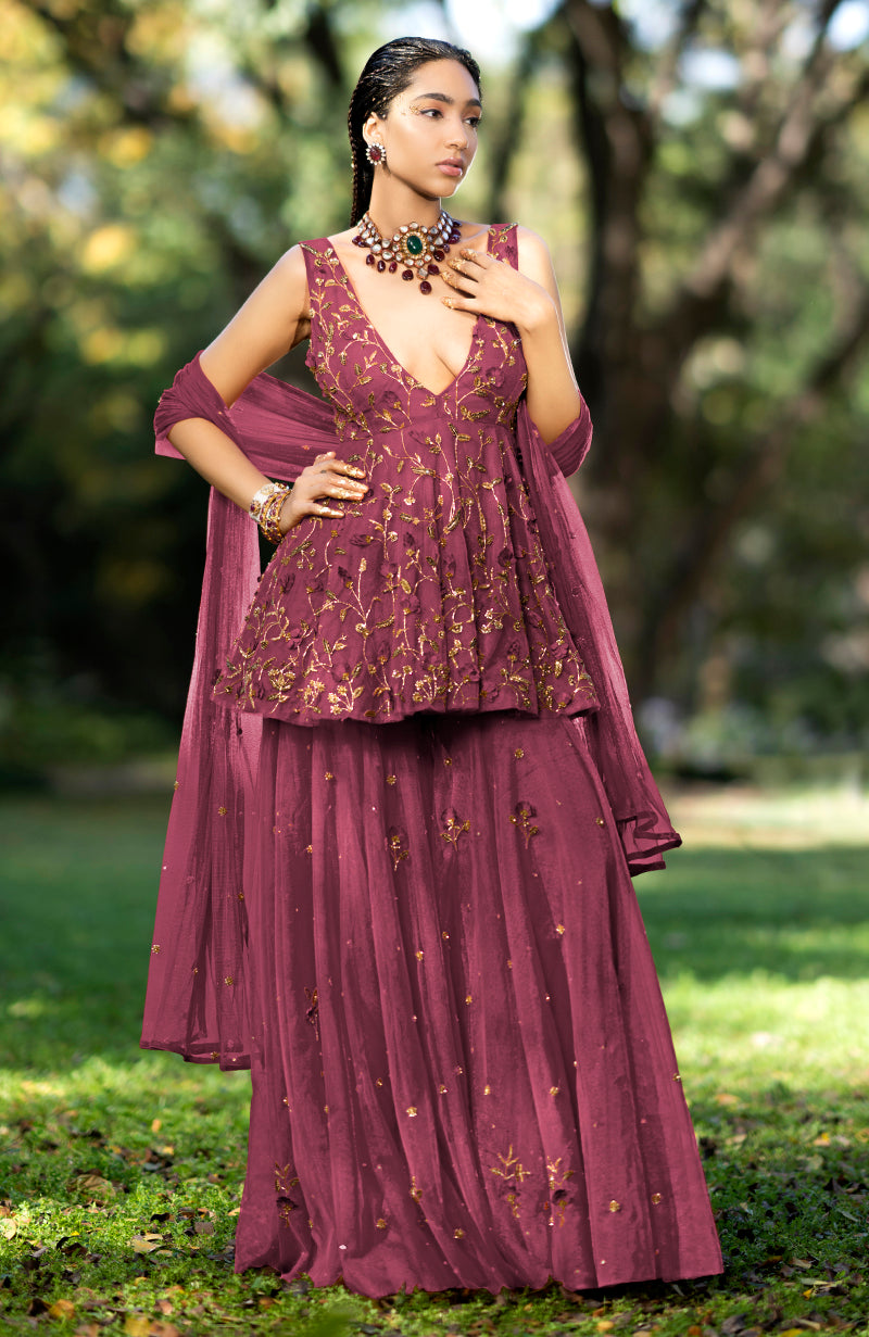 Berry-colored sharara set with 3-D floral suede embroidery and deep V-neck peplum top