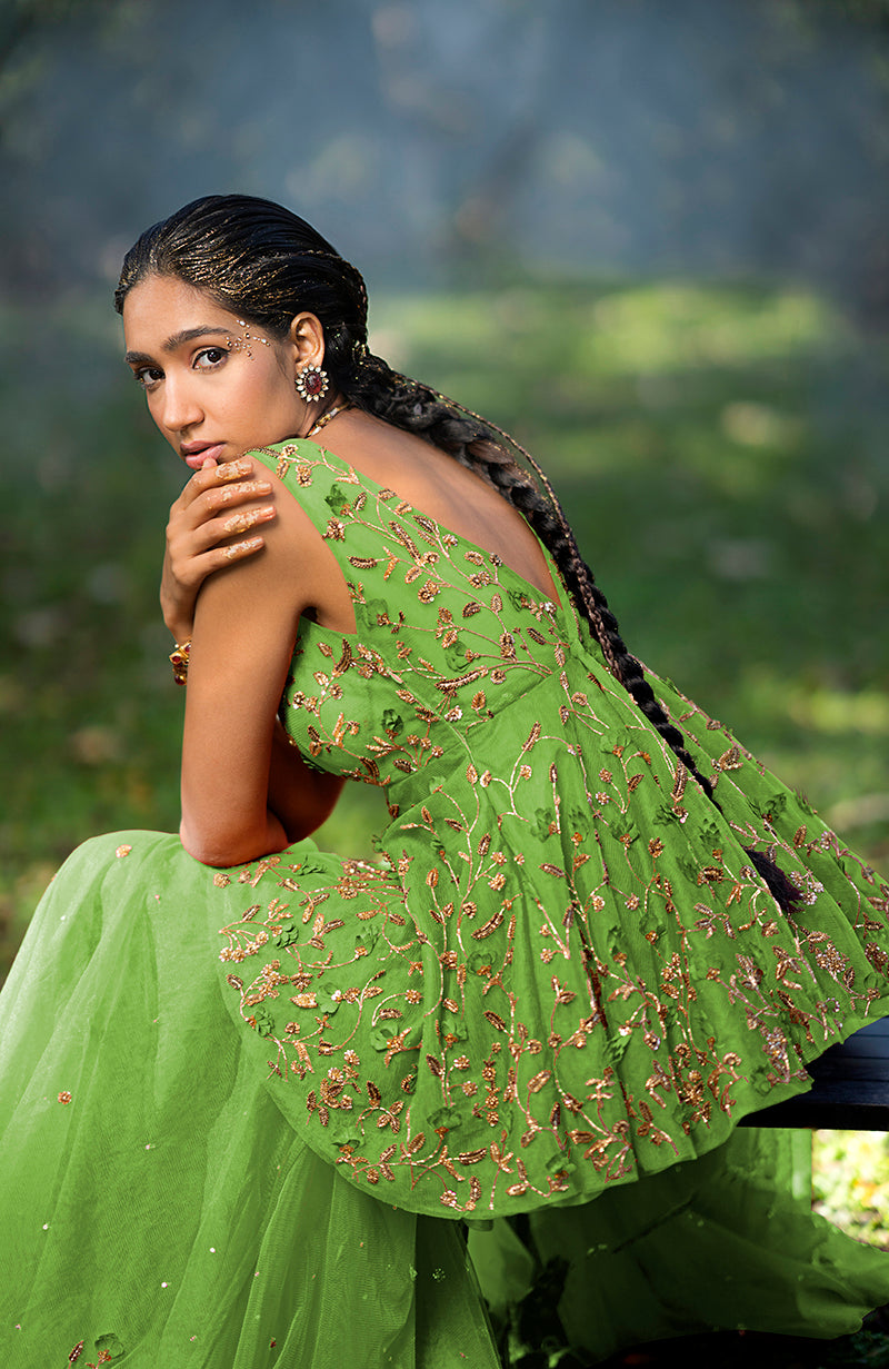 A woman models a Mehandi Green 3D Floral & Zardozi Hand Embroidered Sharara Set.