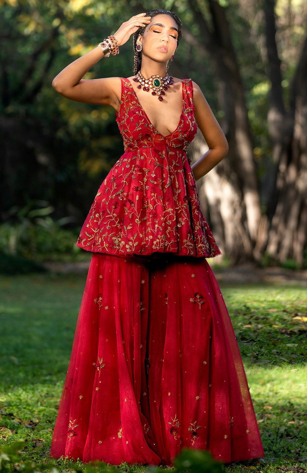 Red sharara set with 3-D floral and zardozi hand embroidery on tulle fabric.