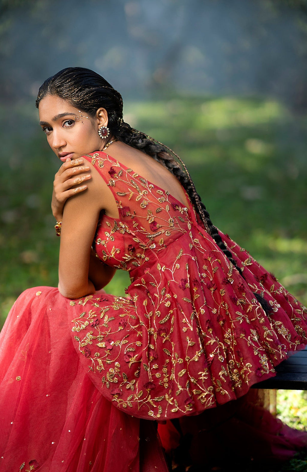 Red sharara set with 3-D floral and zardozi hand embroidery on tulle fabric.