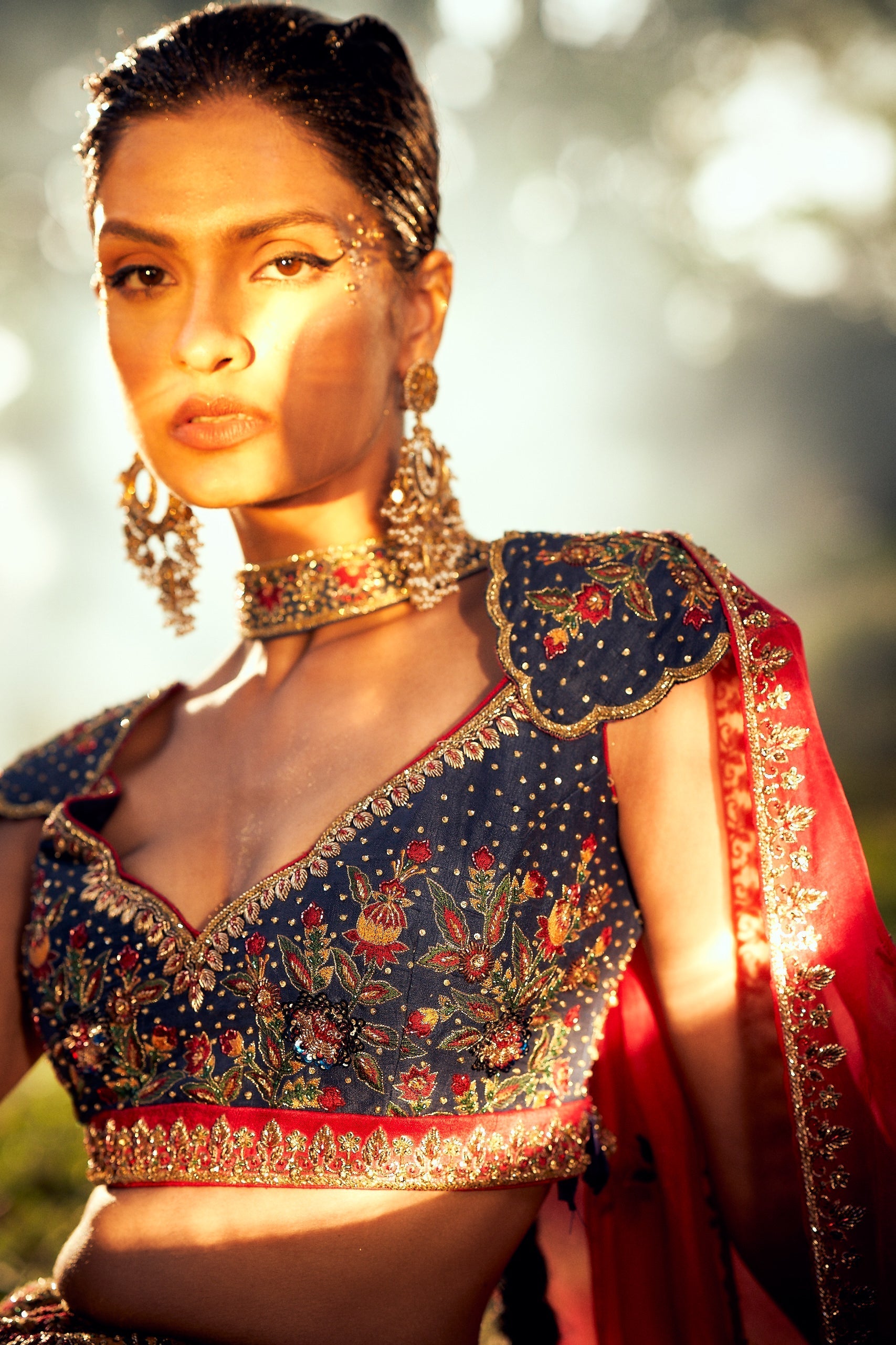 Classic blue raw silk blouse with gold zardozi and multicolor floral embroidery and cap sleeves