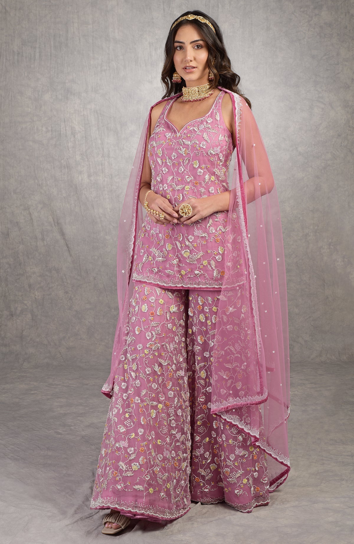 Mauve orchid sharara set with hand-embroidered floral motifs and velvet trims on organza fabric.