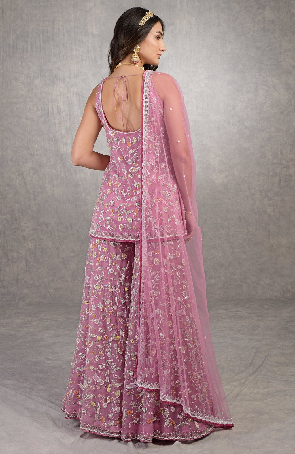 Mauve orchid sharara set with hand-embroidered floral motifs and velvet trims on organza fabric.