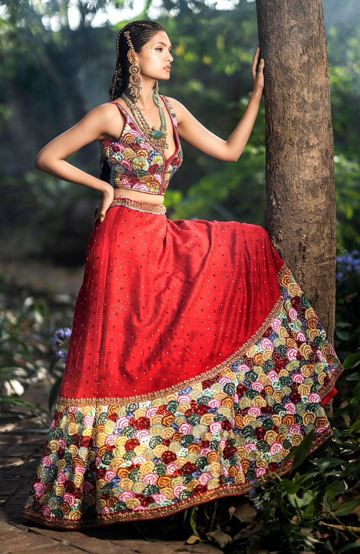 Red raw silk blouse with multicolor resham embroidery and floral motifs, sweetheart neck design.