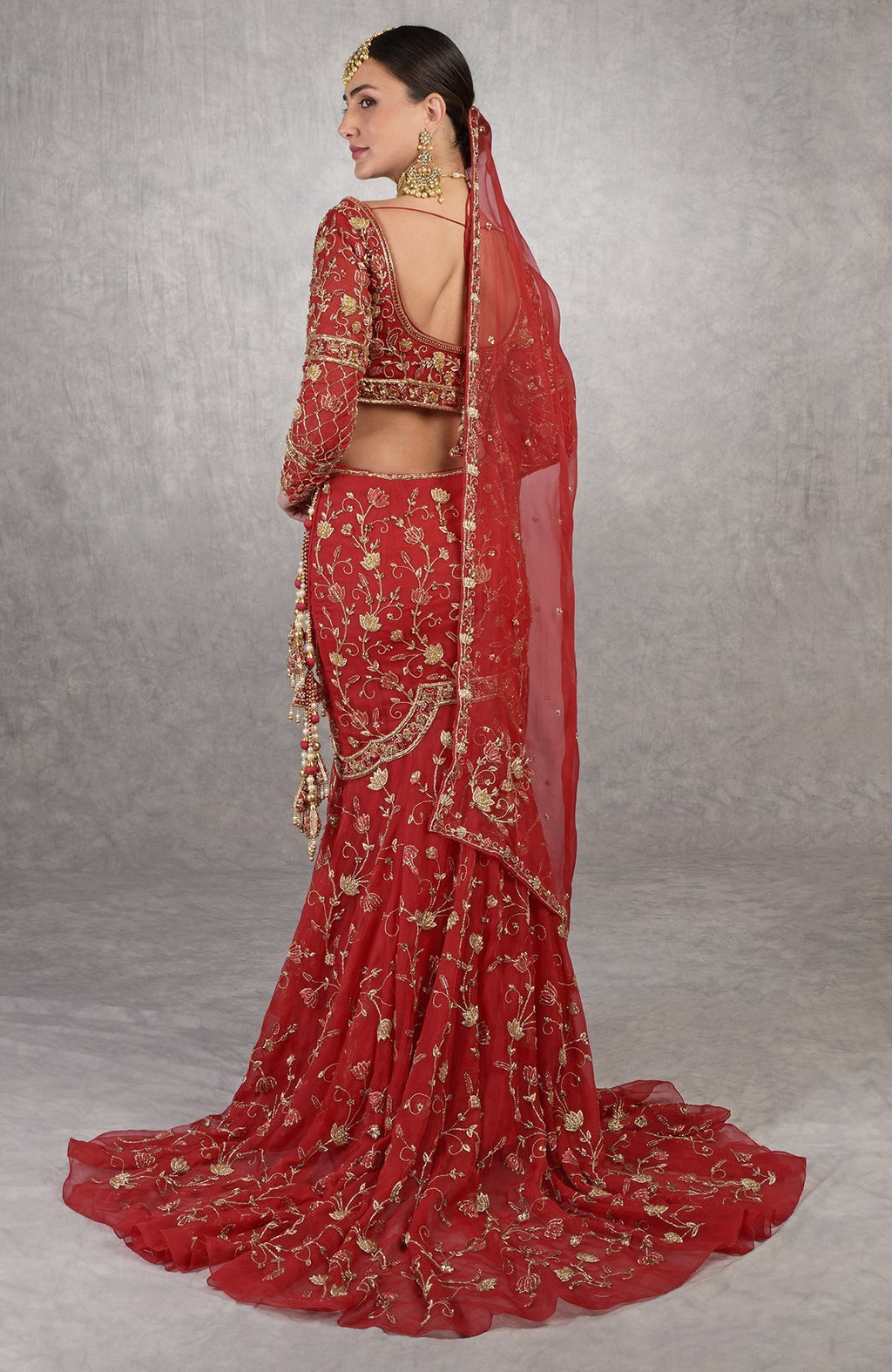 Red blouse with hand-embroidered red lotus motifs and sheer organza full sleeves.